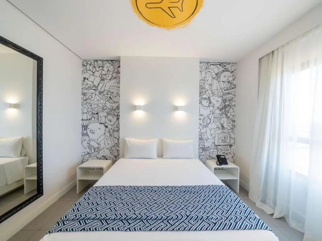 Bed in Golden Tower Maracanaú by Fênix Hotéis