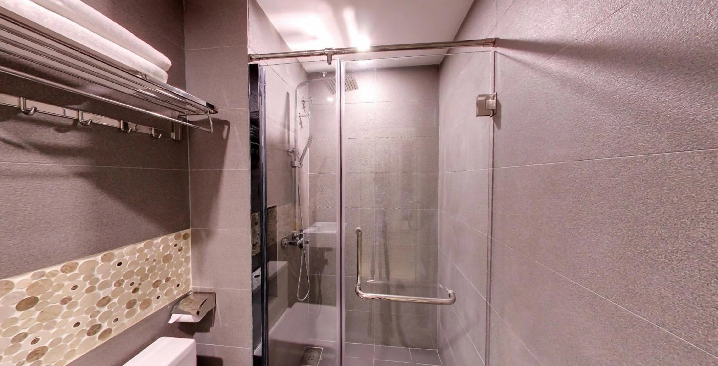 Shower in Flora by Crossroads Hotel