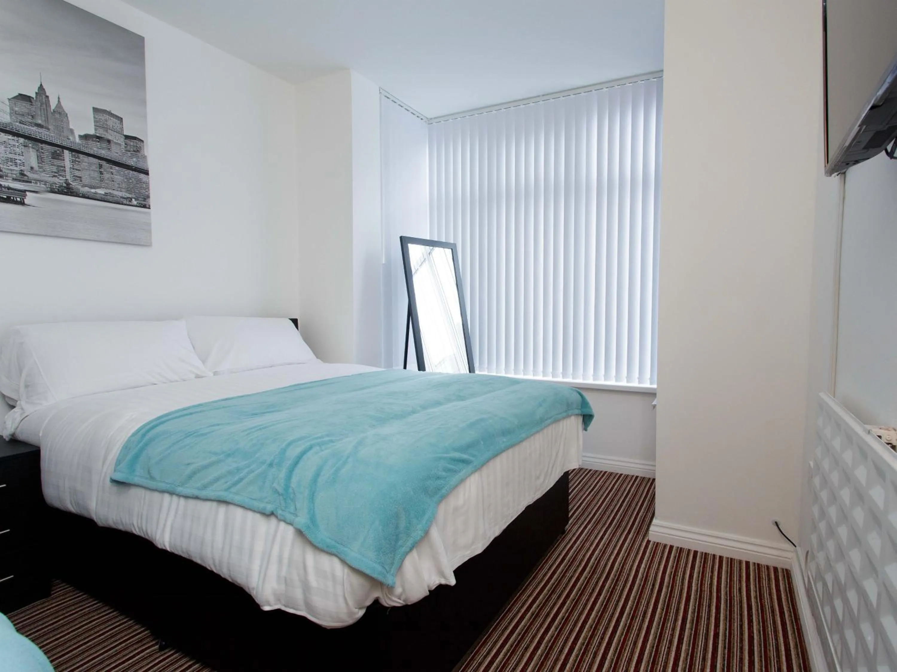 Bedroom in Ruth Apartments