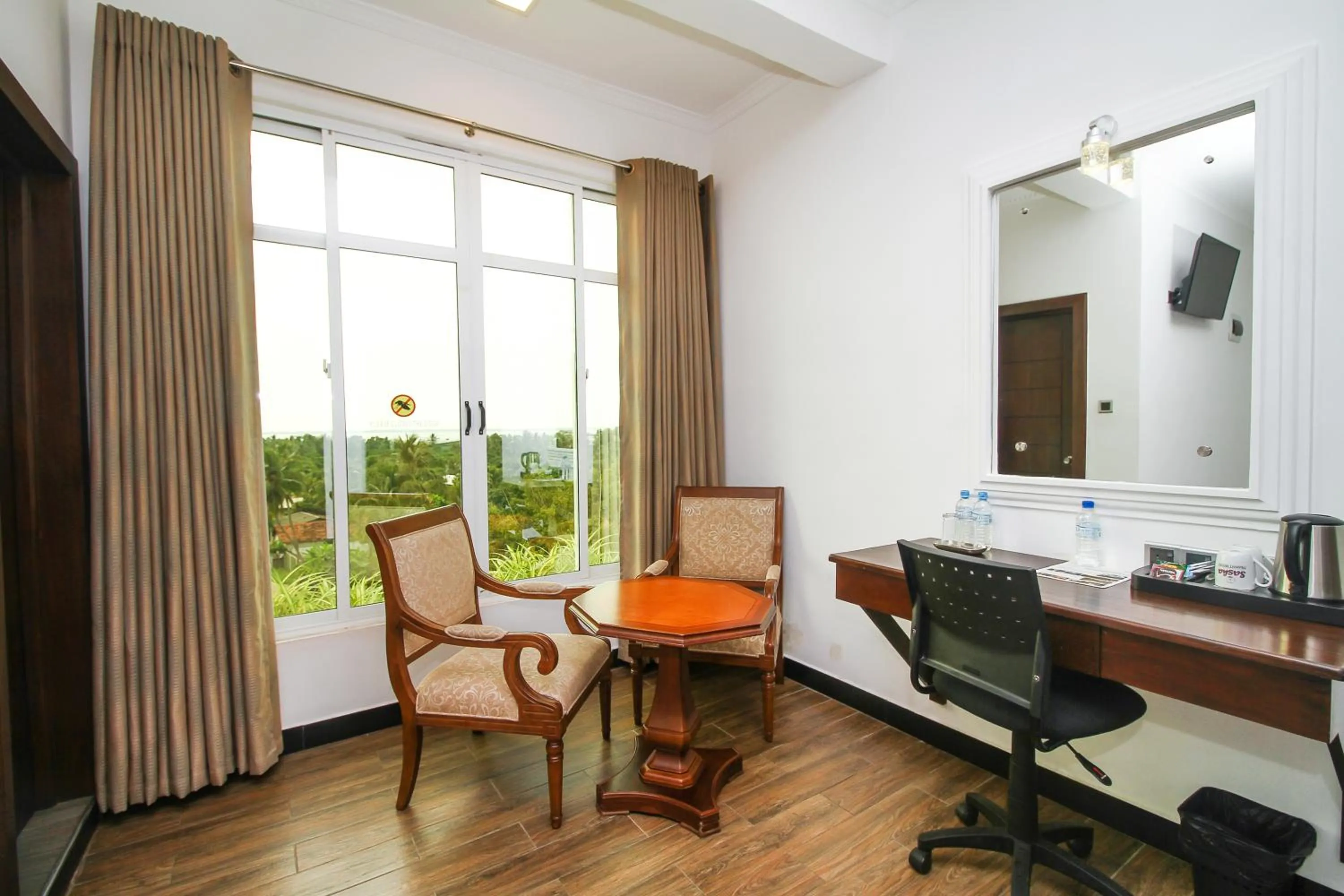 Seating area in Sasha Transit Hotel