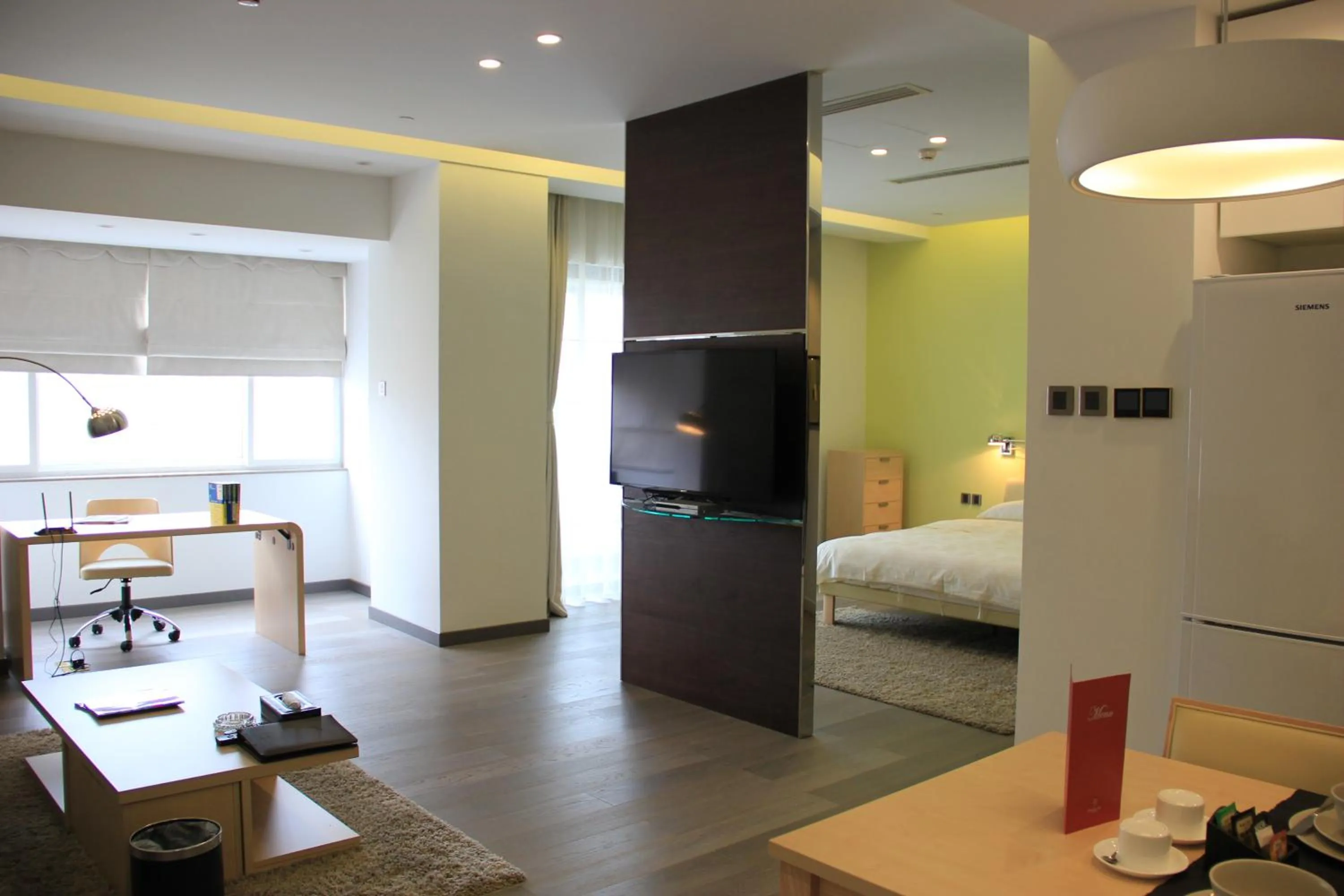 Living room, Bed in Green Park Hotel Tianjin