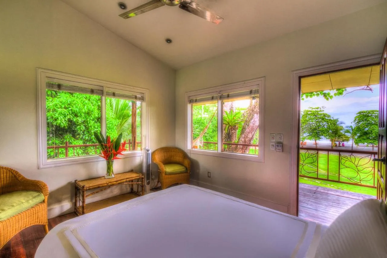 Photo of the whole room, Bed in Iguana Lodge Beach Resort