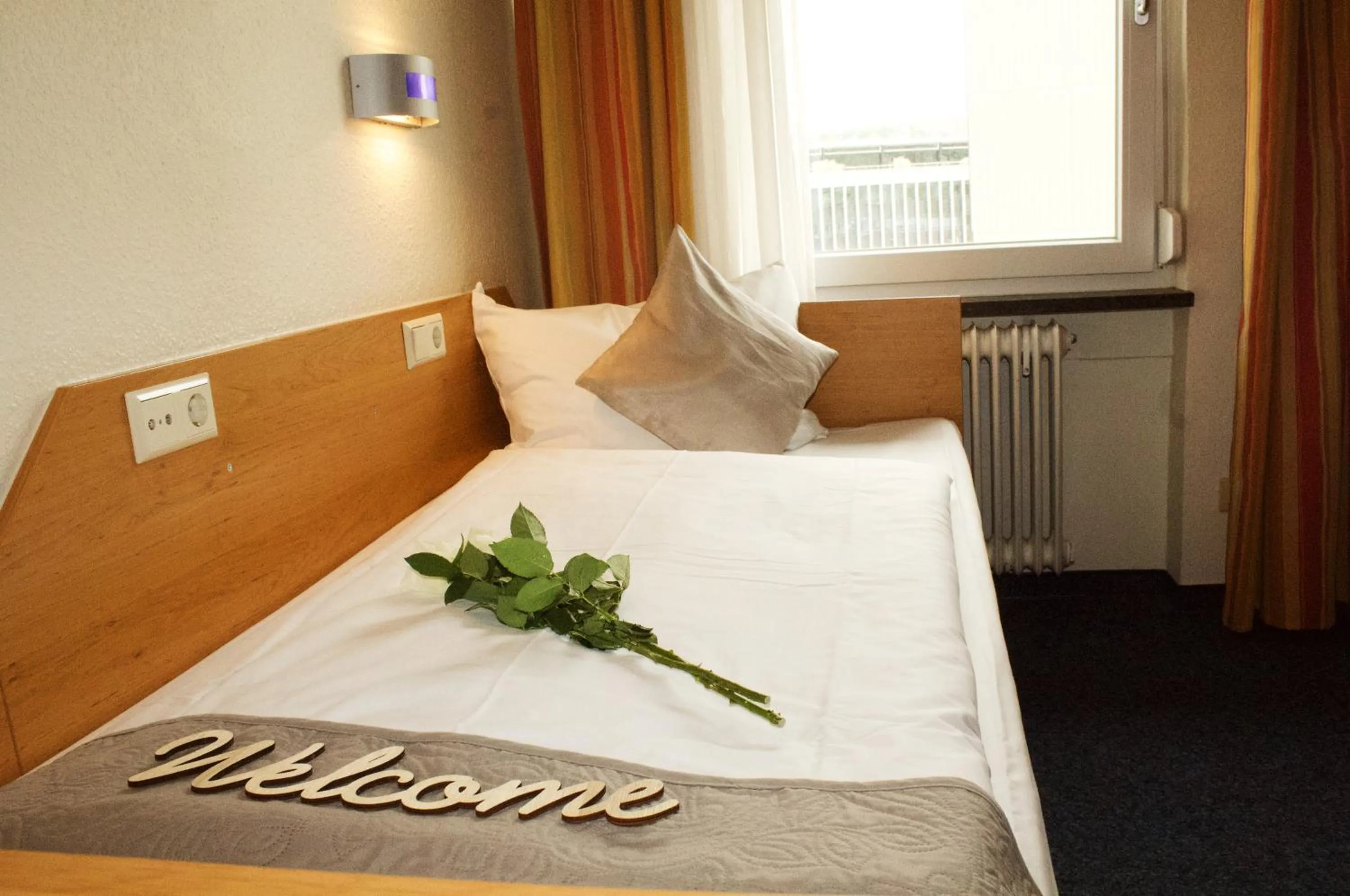 Photo of the whole room, Bed in Hotel Austria Stuttgart-City