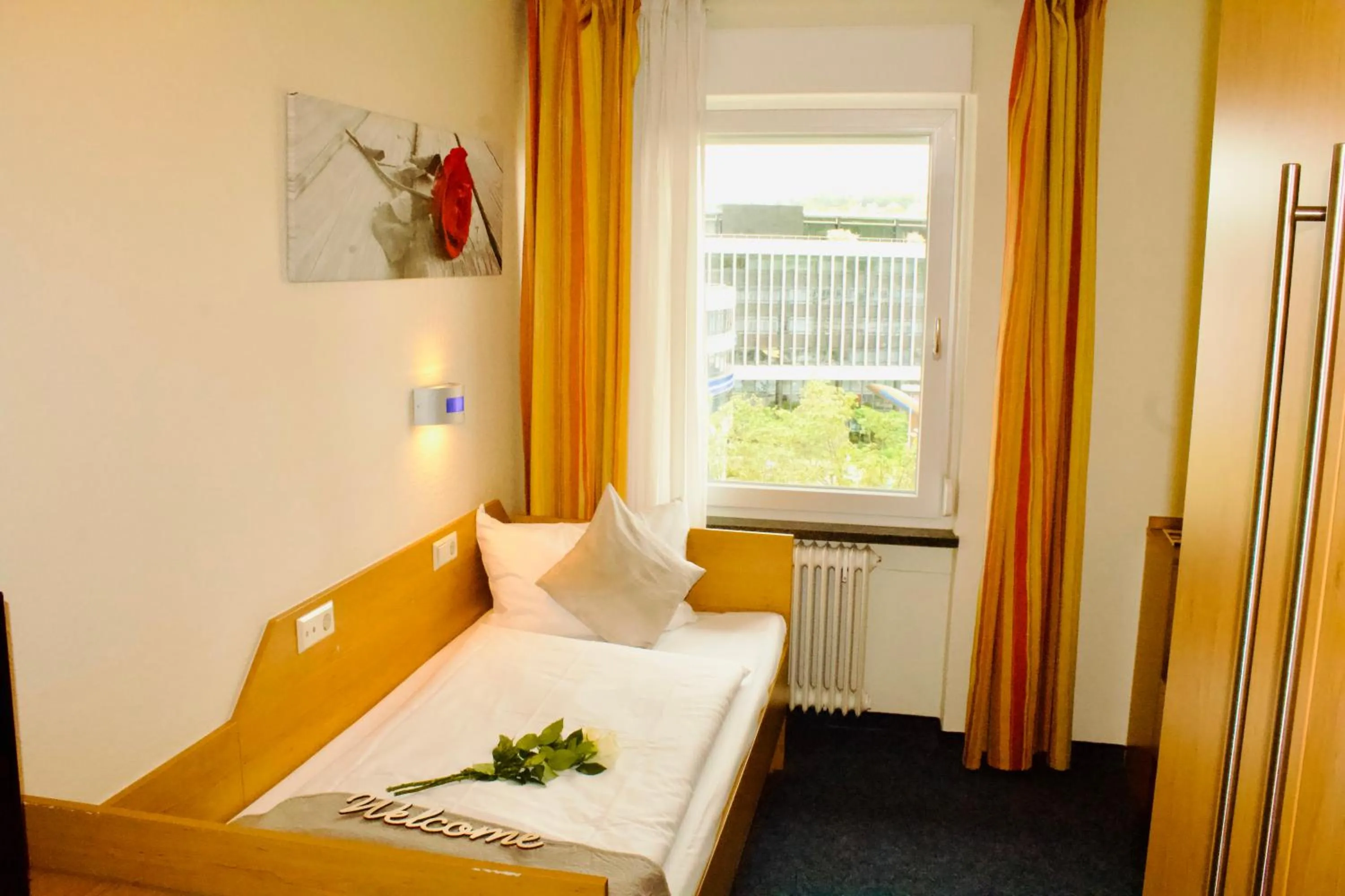 Photo of the whole room, Bed in Hotel Austria Stuttgart-City