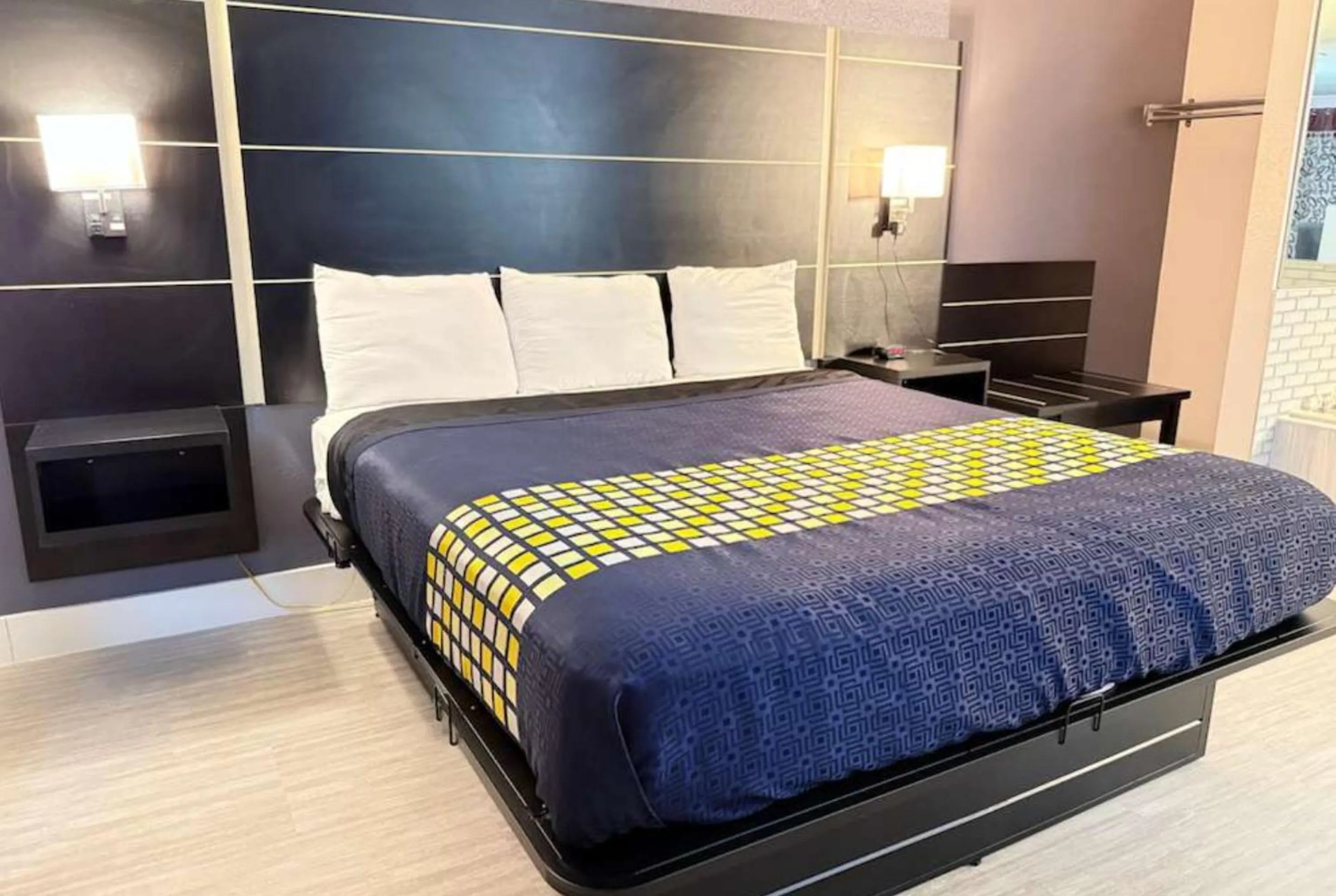 Bed in Coratel Inn & Suites by Jasper Hastings