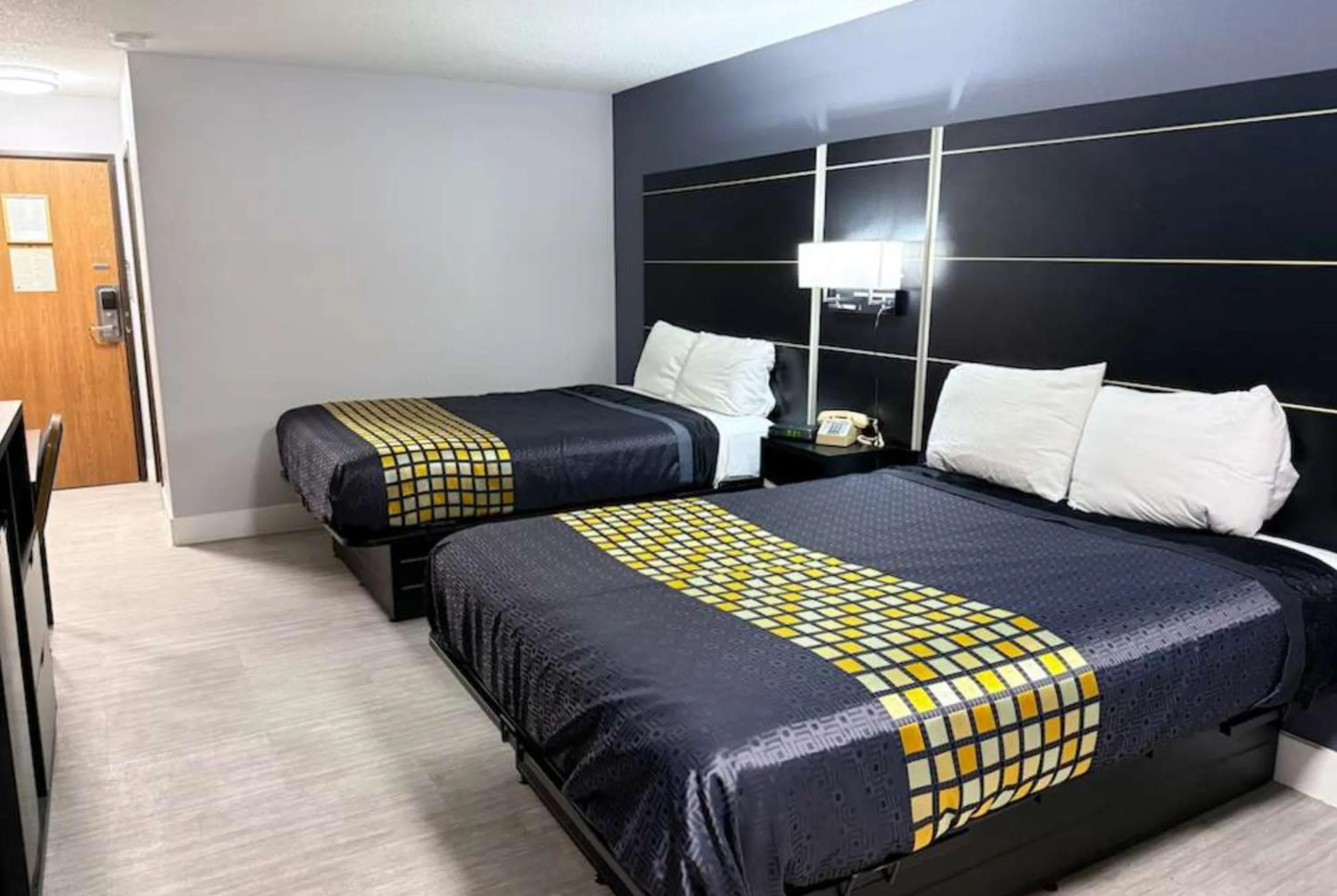 Bed in Coratel Inn & Suites by Jasper Hastings