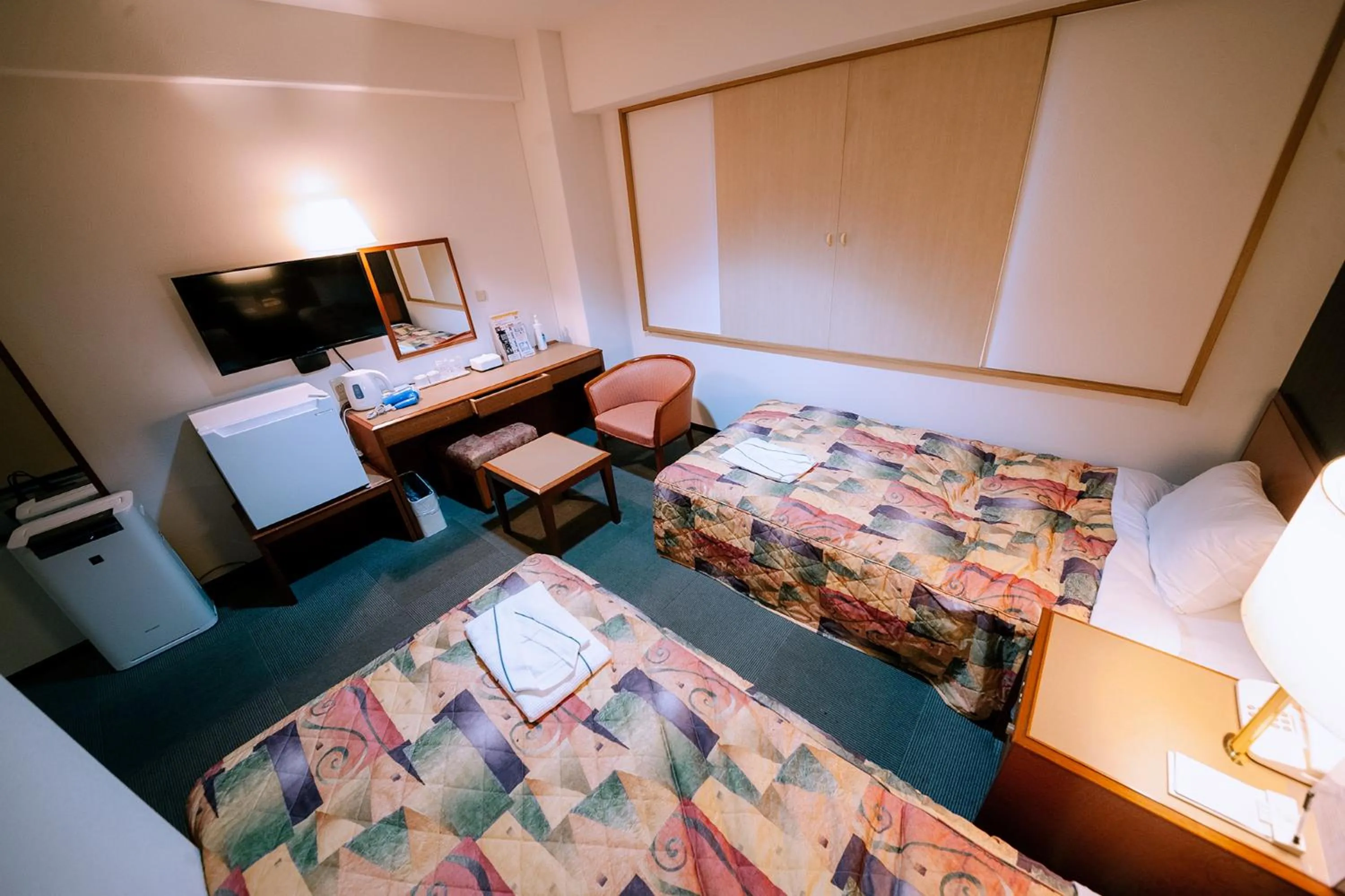 Bed in Plaza Hotel Nogata