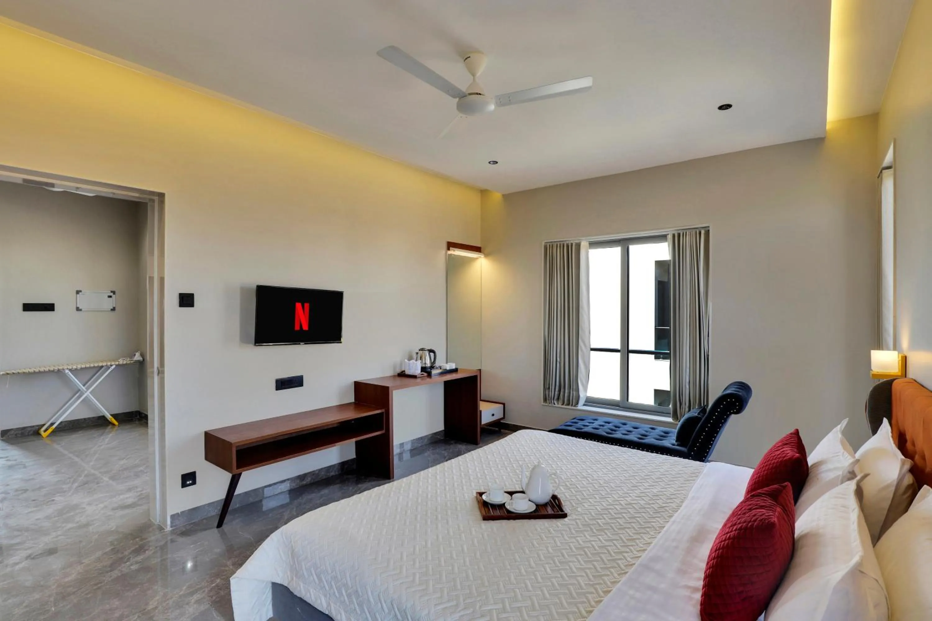 Photo of the whole room, Bed in Goverdhan Greens Resort Dwarka l Hotels In Dwarka