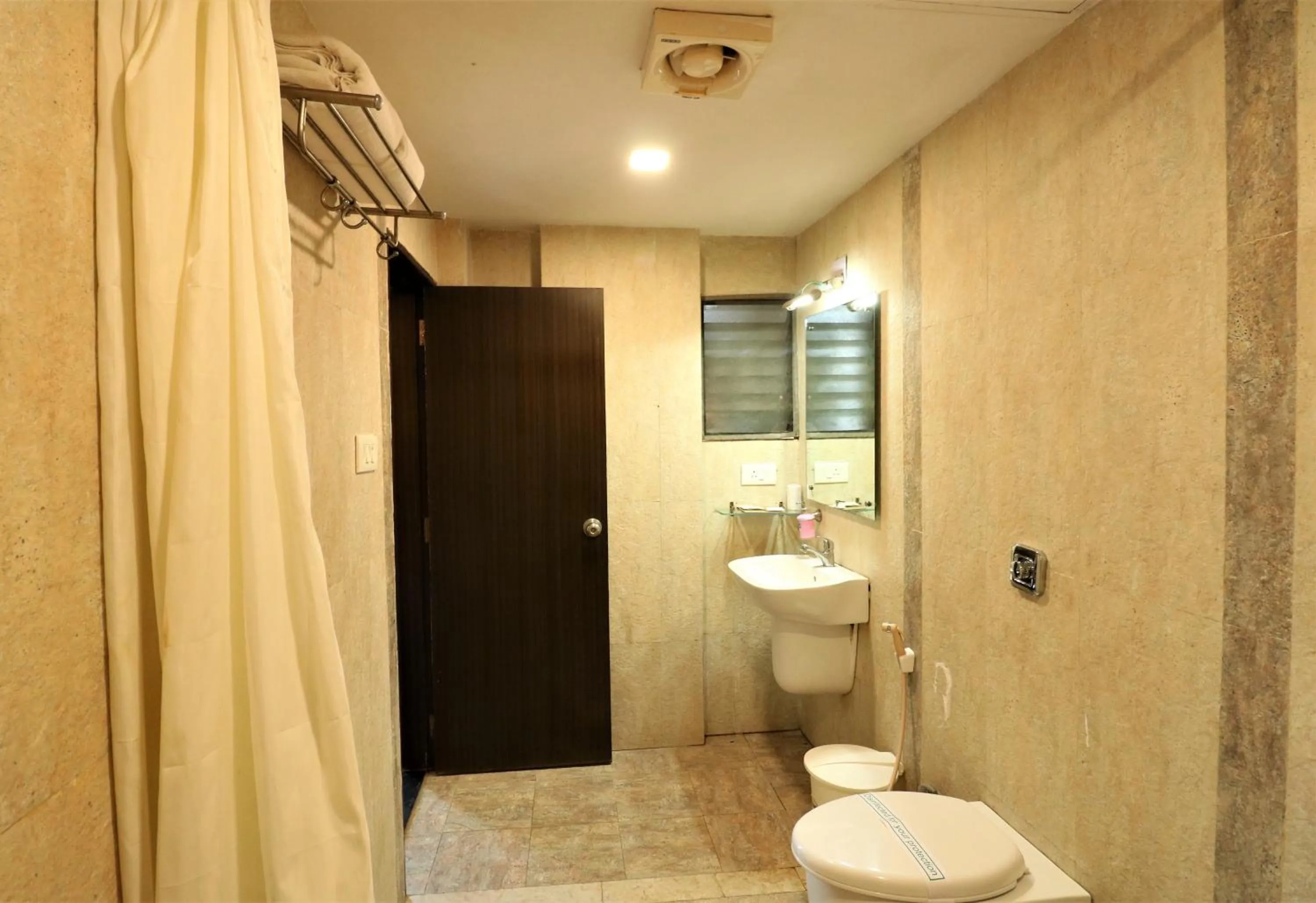 Bathroom in Goverdhan Greens Resort Dwarka l Hotels In Dwarka