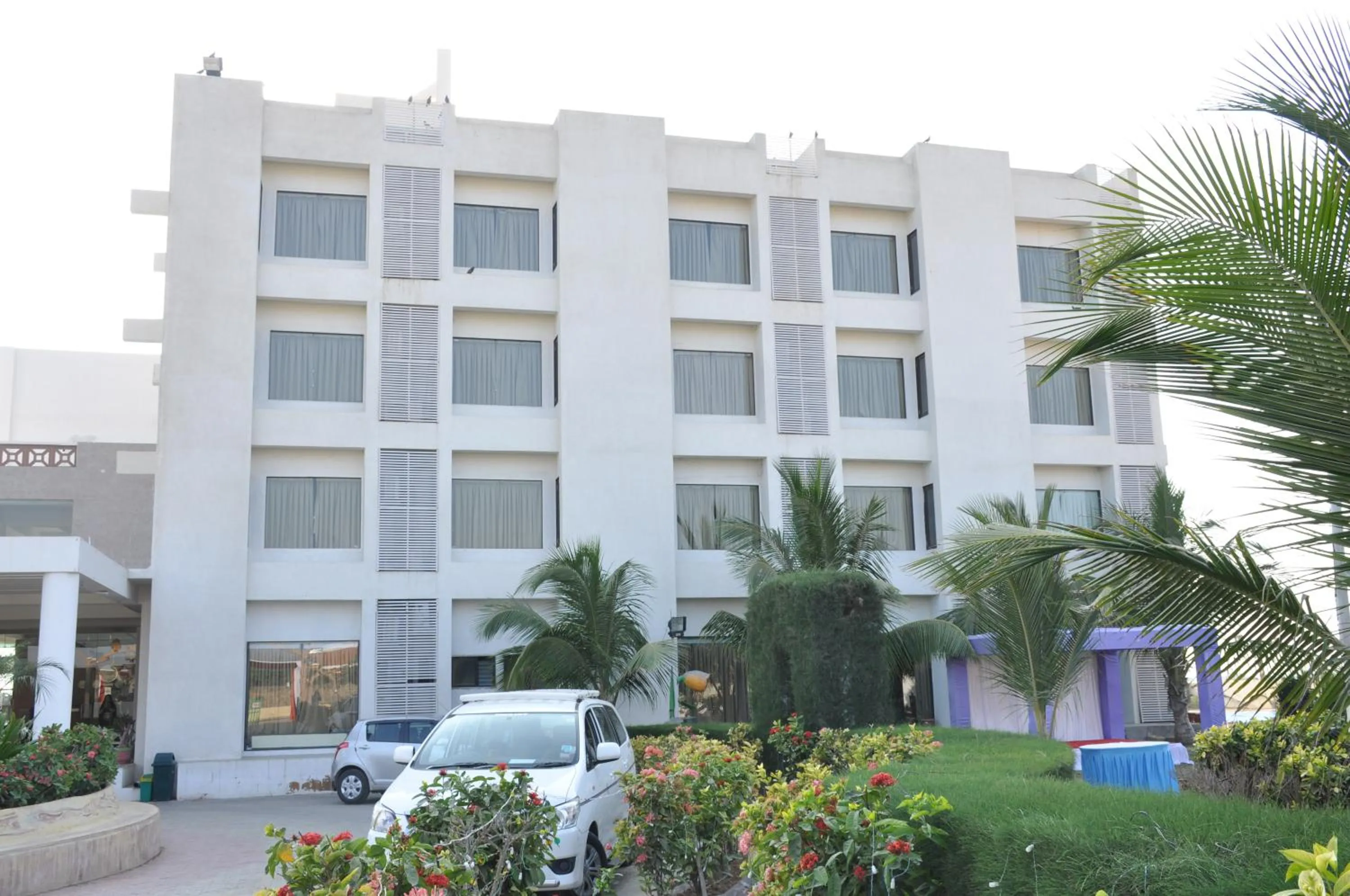 Property building in Goverdhan Greens Resort Dwarka l Hotels In Dwarka