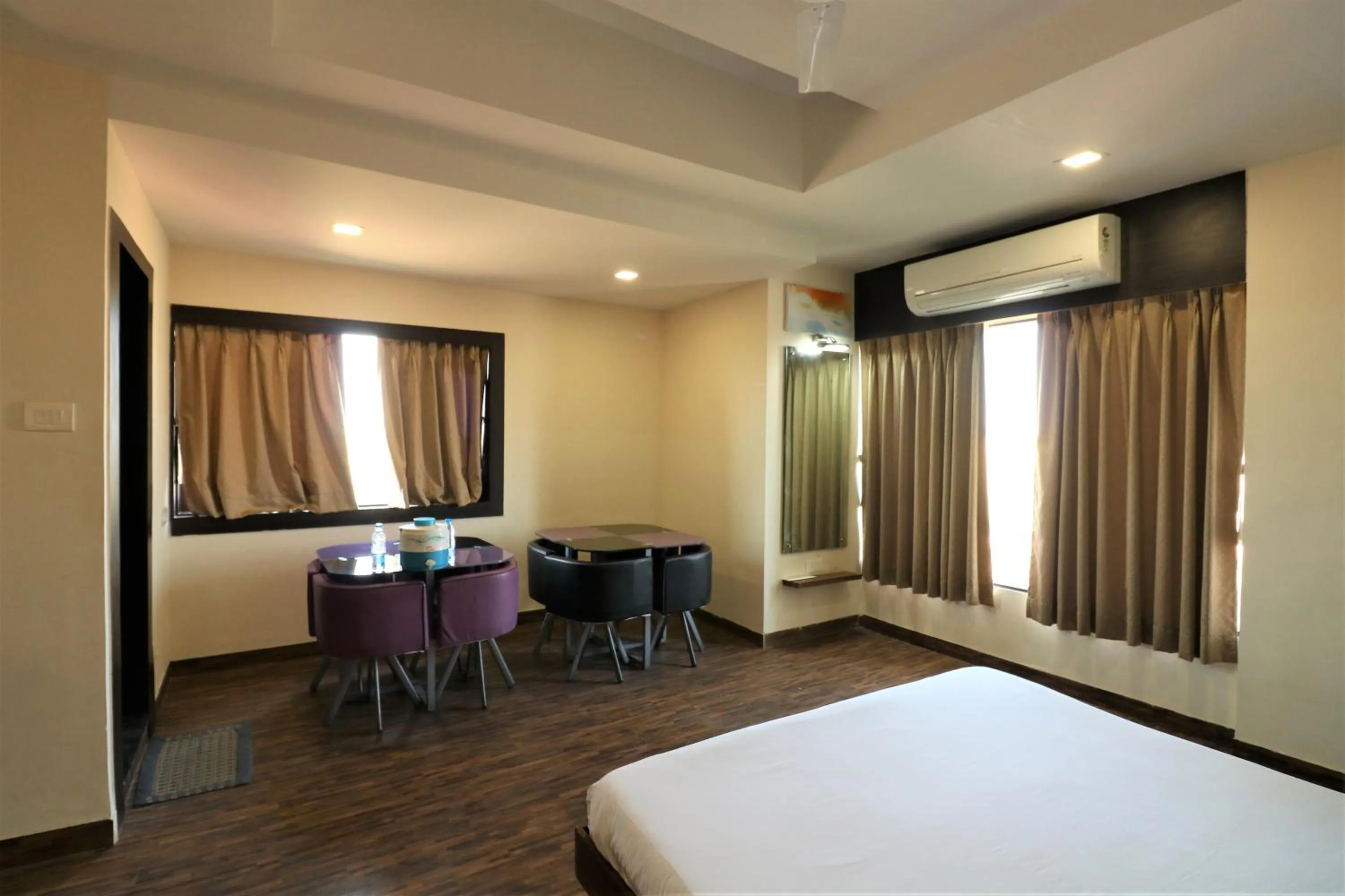 Photo of the whole room, Bed in Goverdhan Greens Resort Dwarka l Hotels In Dwarka