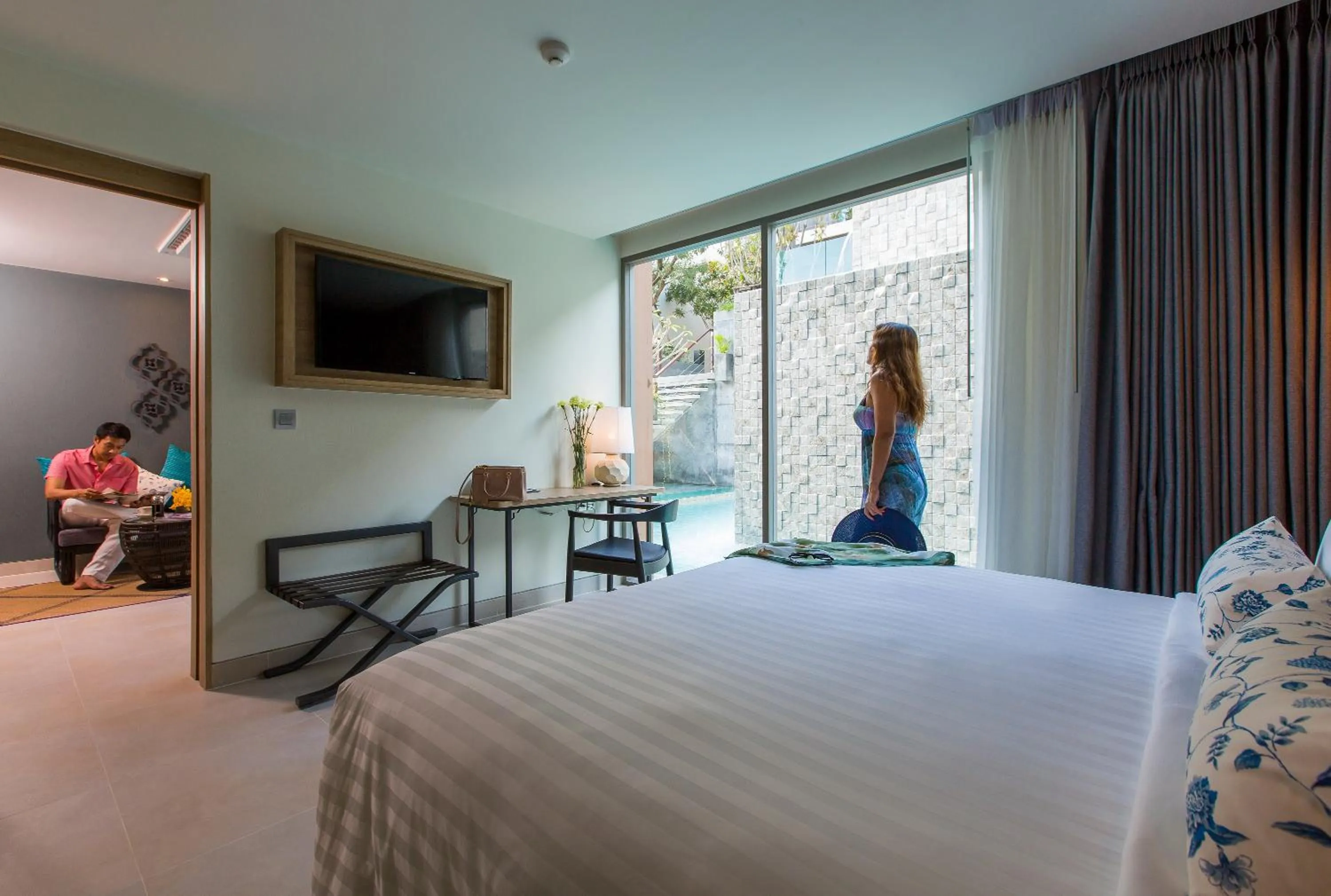 Living room, Bed in Fusion Suites Phuket Patong