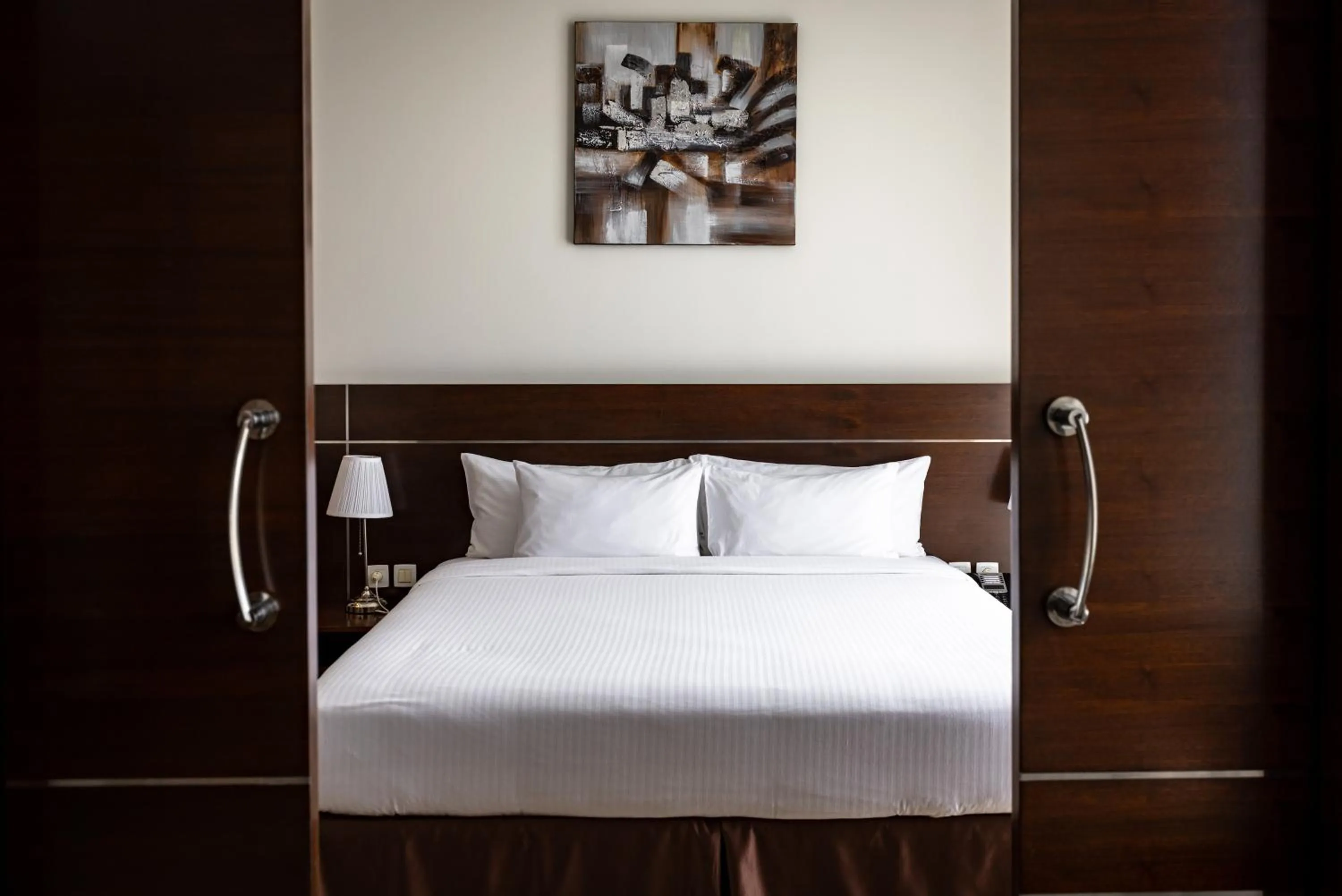 Bed in Palmeiras Suite Hotel