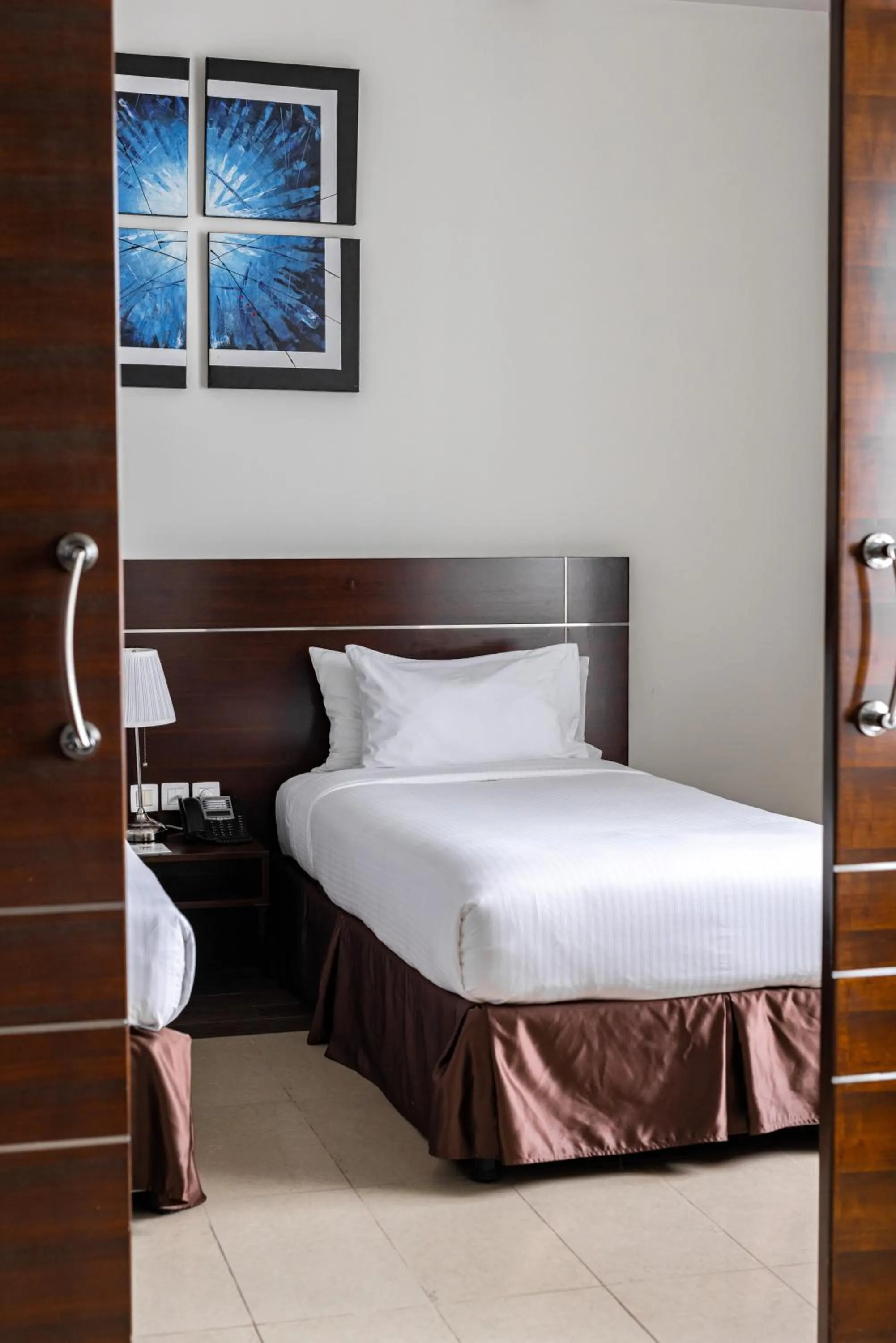 Bed in Palmeiras Suite Hotel