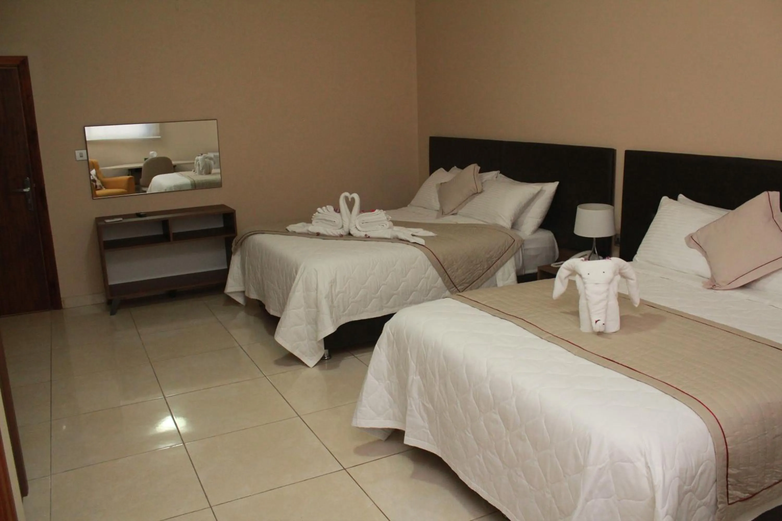 Bed in Murex Plaza Hotel & Suites