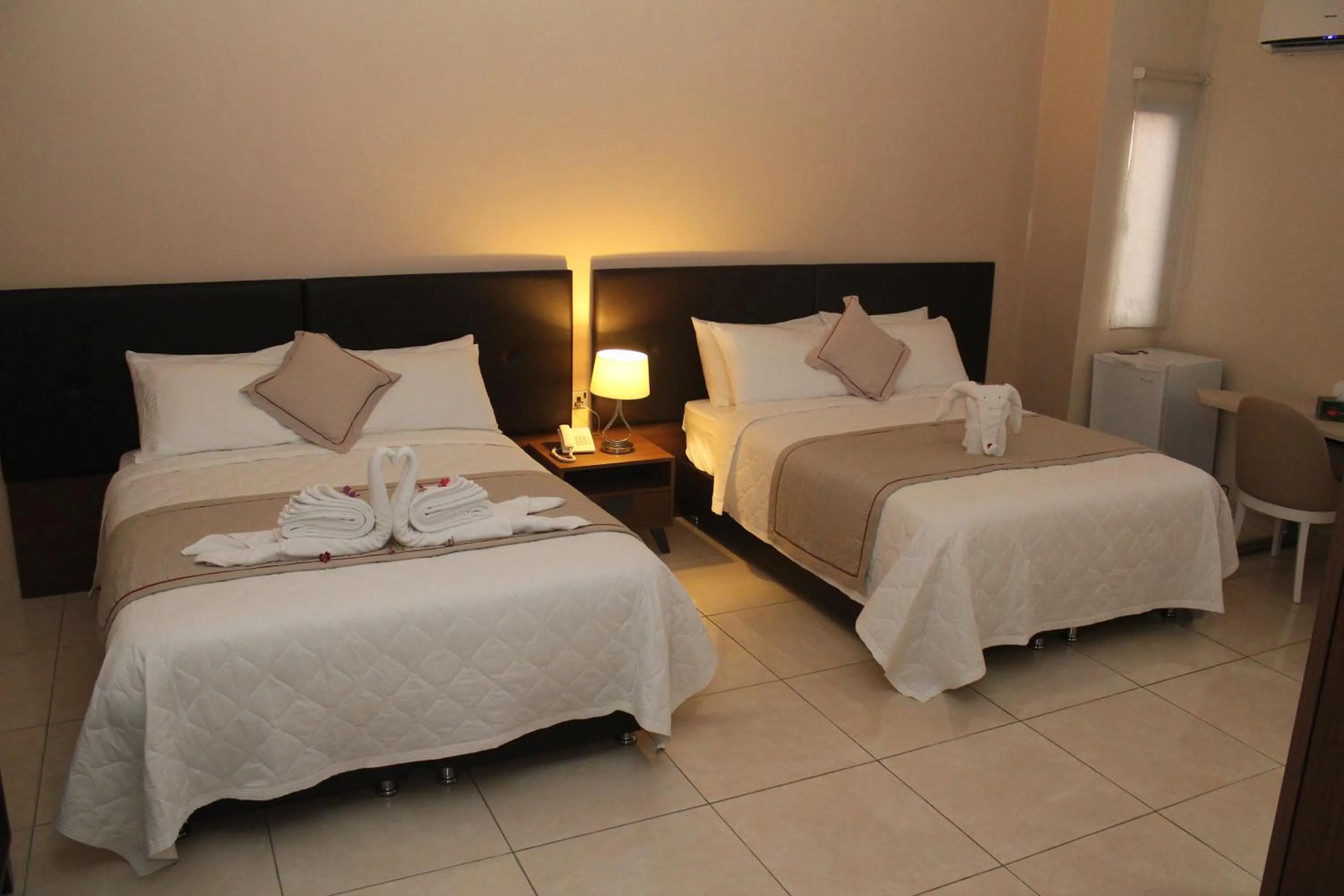Bed in Murex Plaza Hotel & Suites