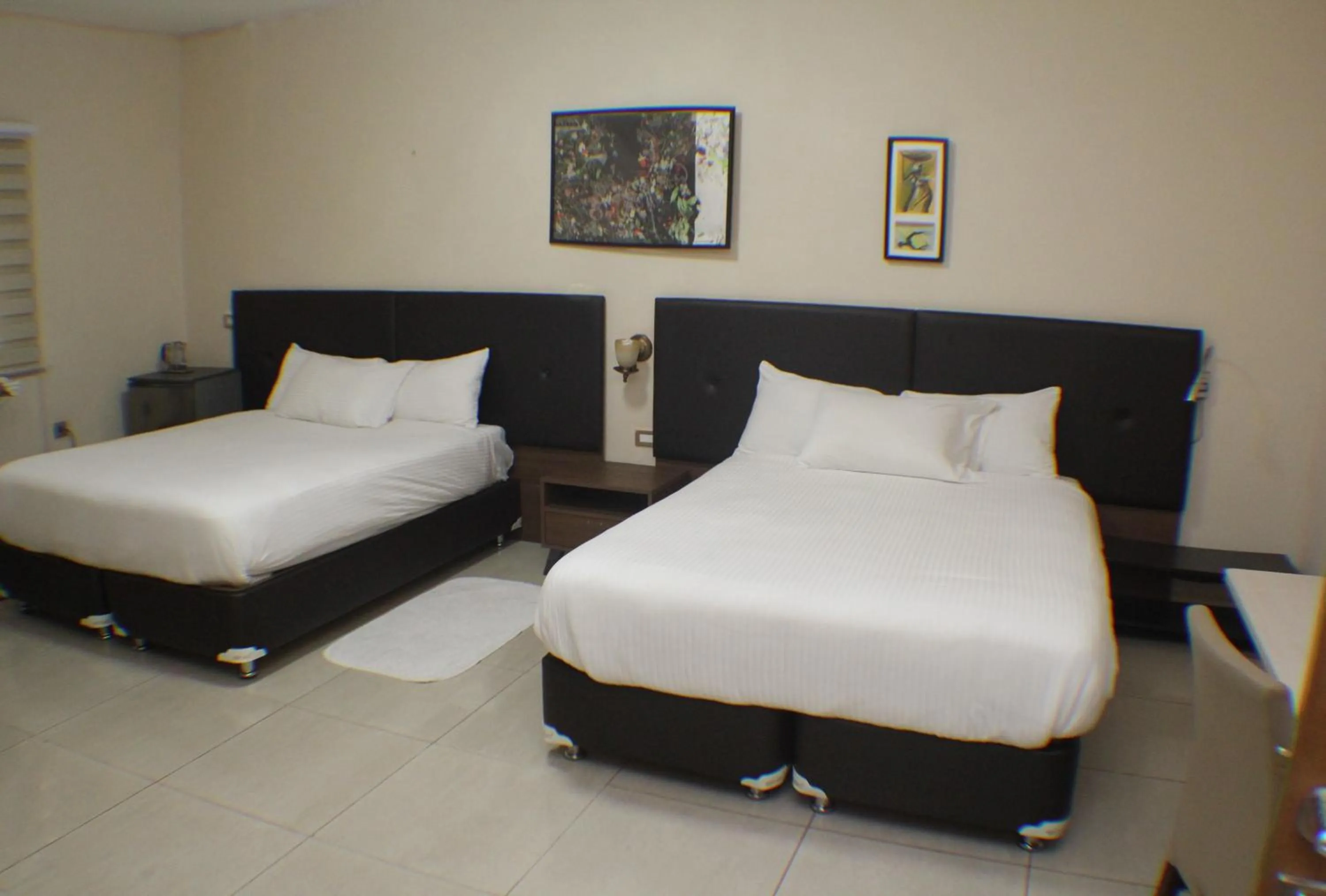 Bed in Murex Plaza Hotel & Suites