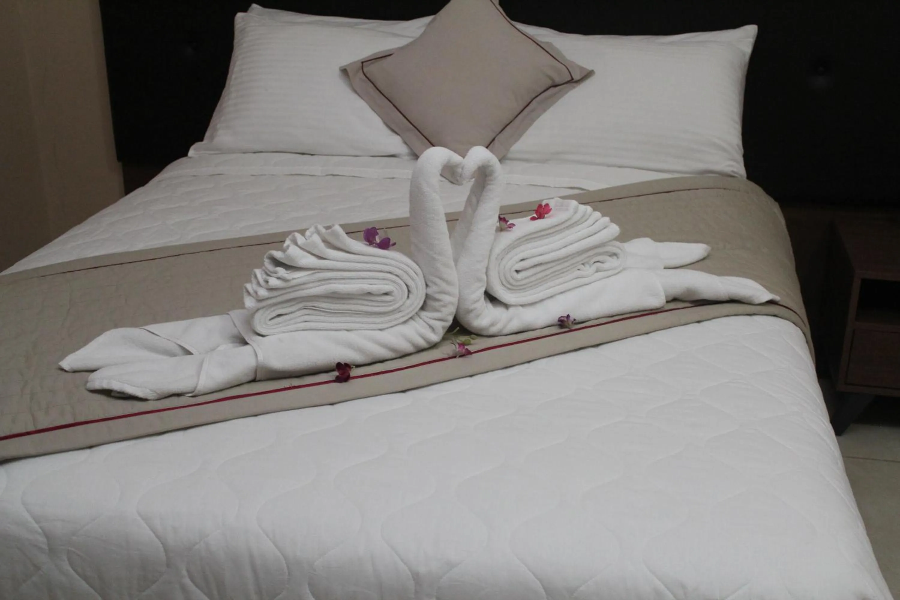 Bed in Murex Plaza Hotel & Suites