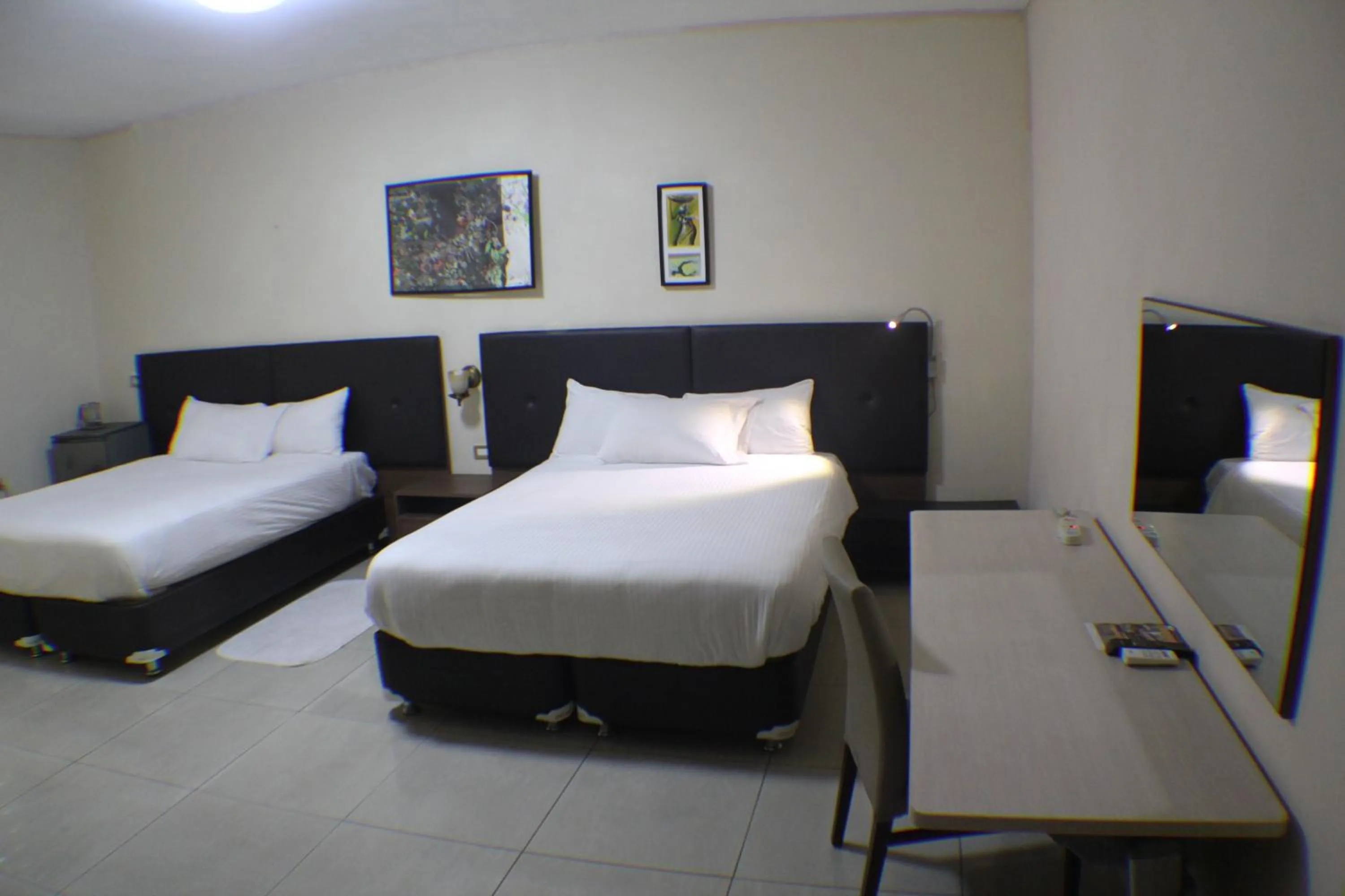 Bed in Murex Plaza Hotel & Suites