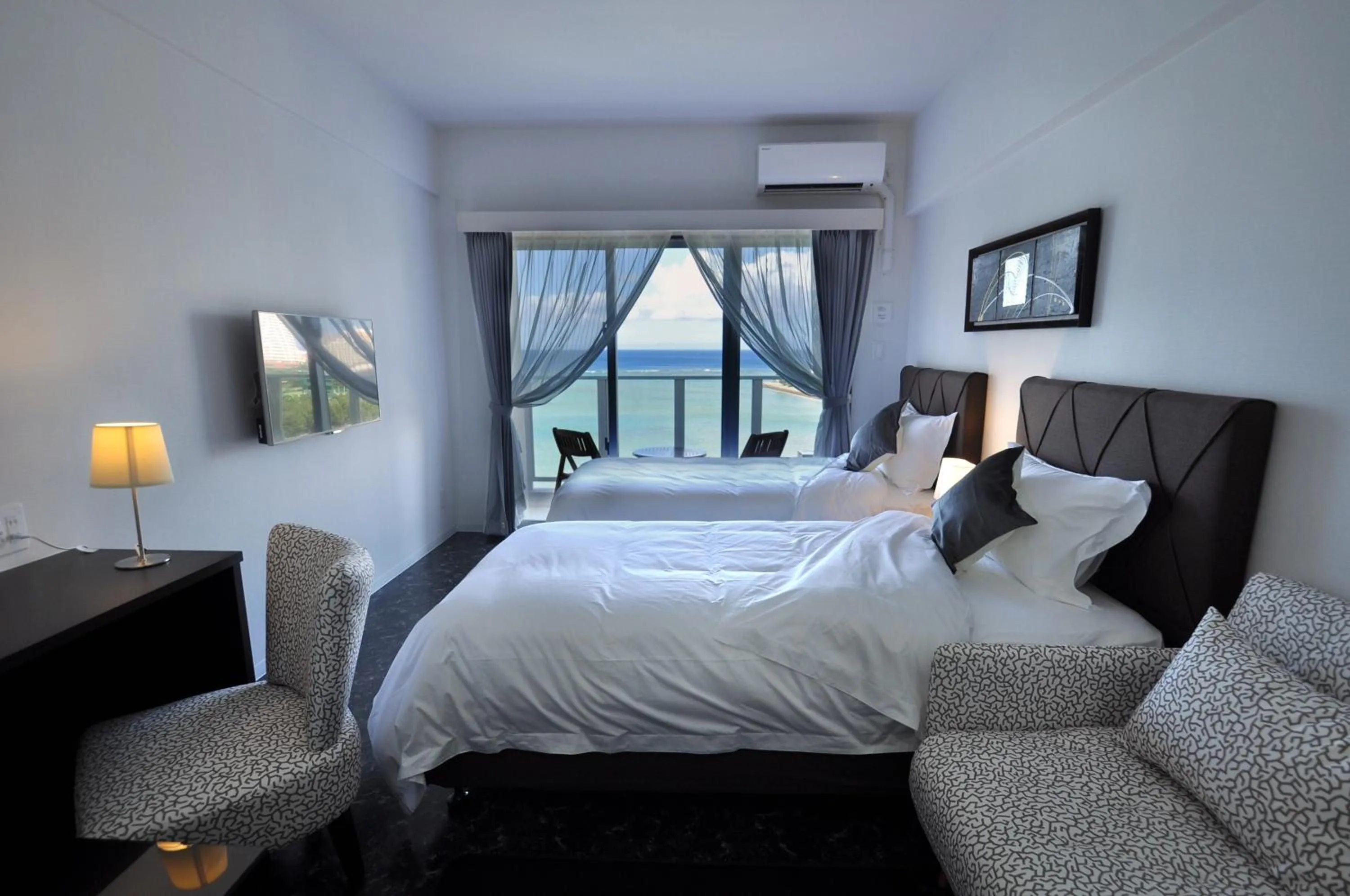 Photo of the whole room, Bed in Beach Front Tower Mihama by DSH