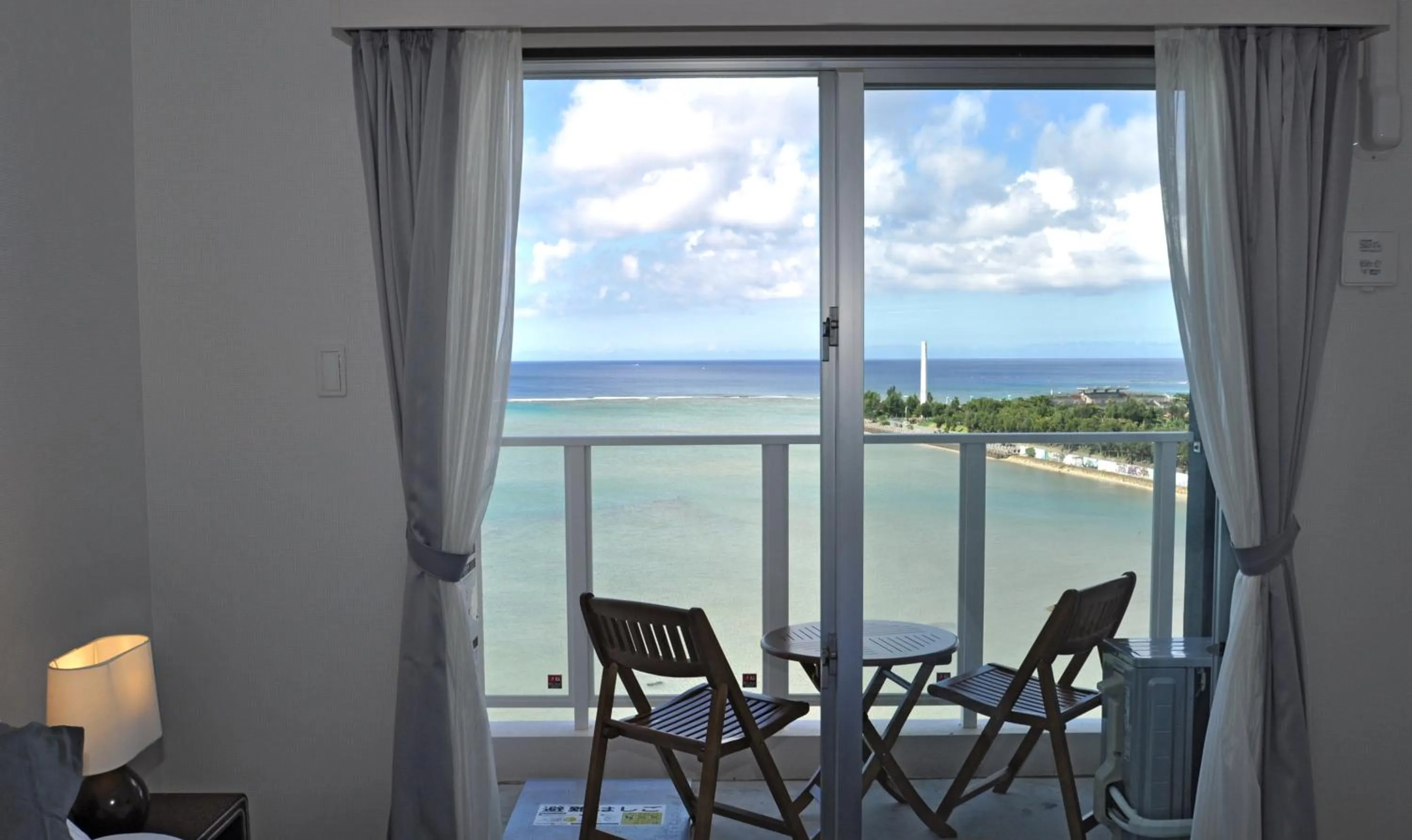 Seating area in Beach Front Tower Mihama by DSH