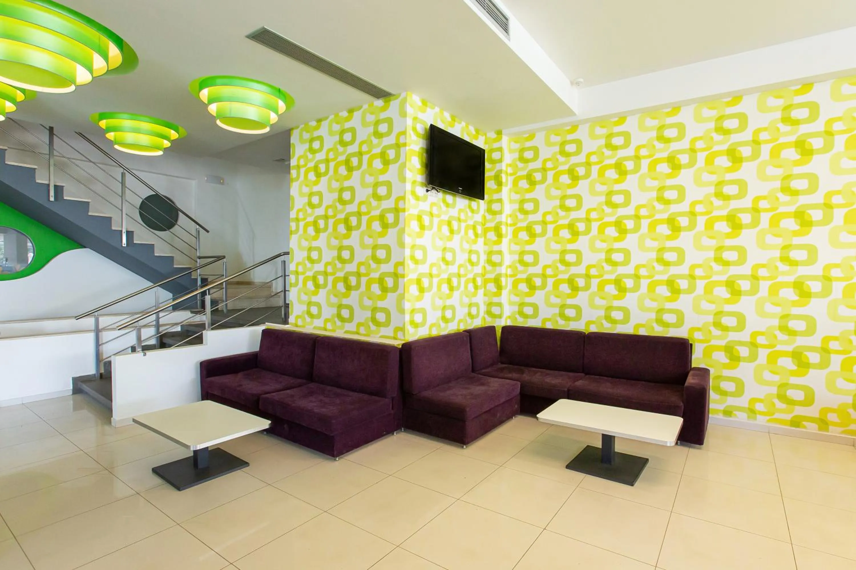 Communal lounge/ TV room in Hermes Hotel