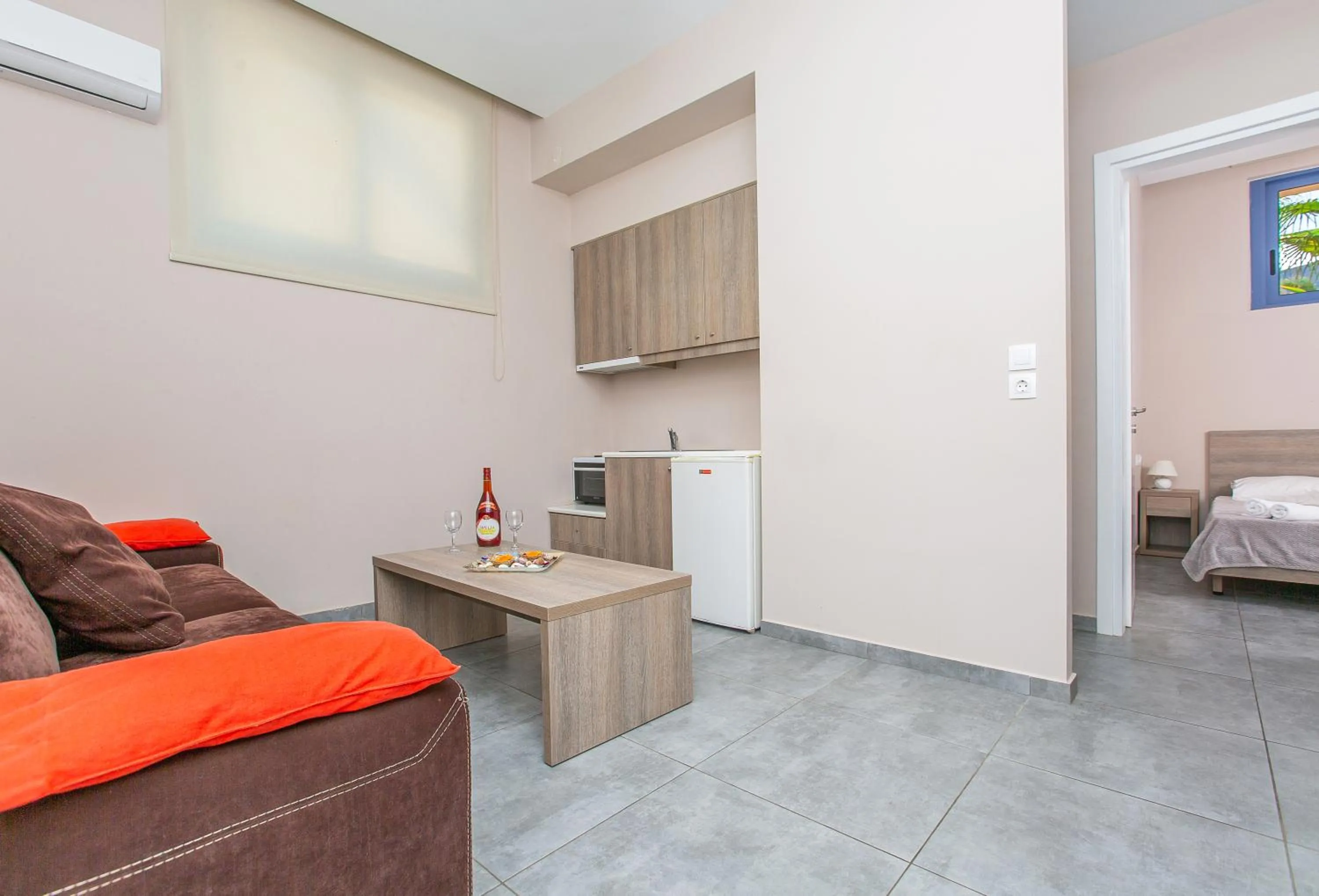 Living room, Bed in Hermes Hotel