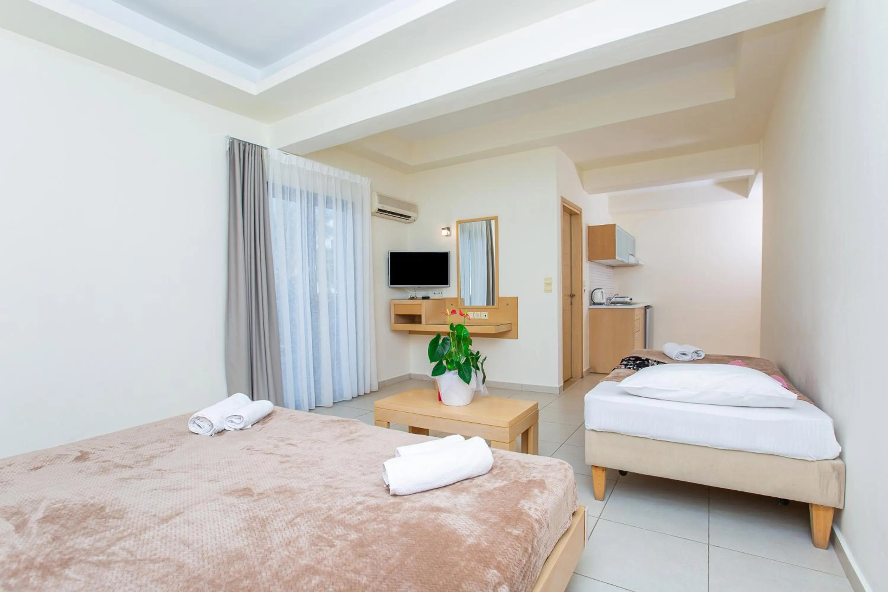 Kitchen or kitchenette, Bed in Hermes Hotel