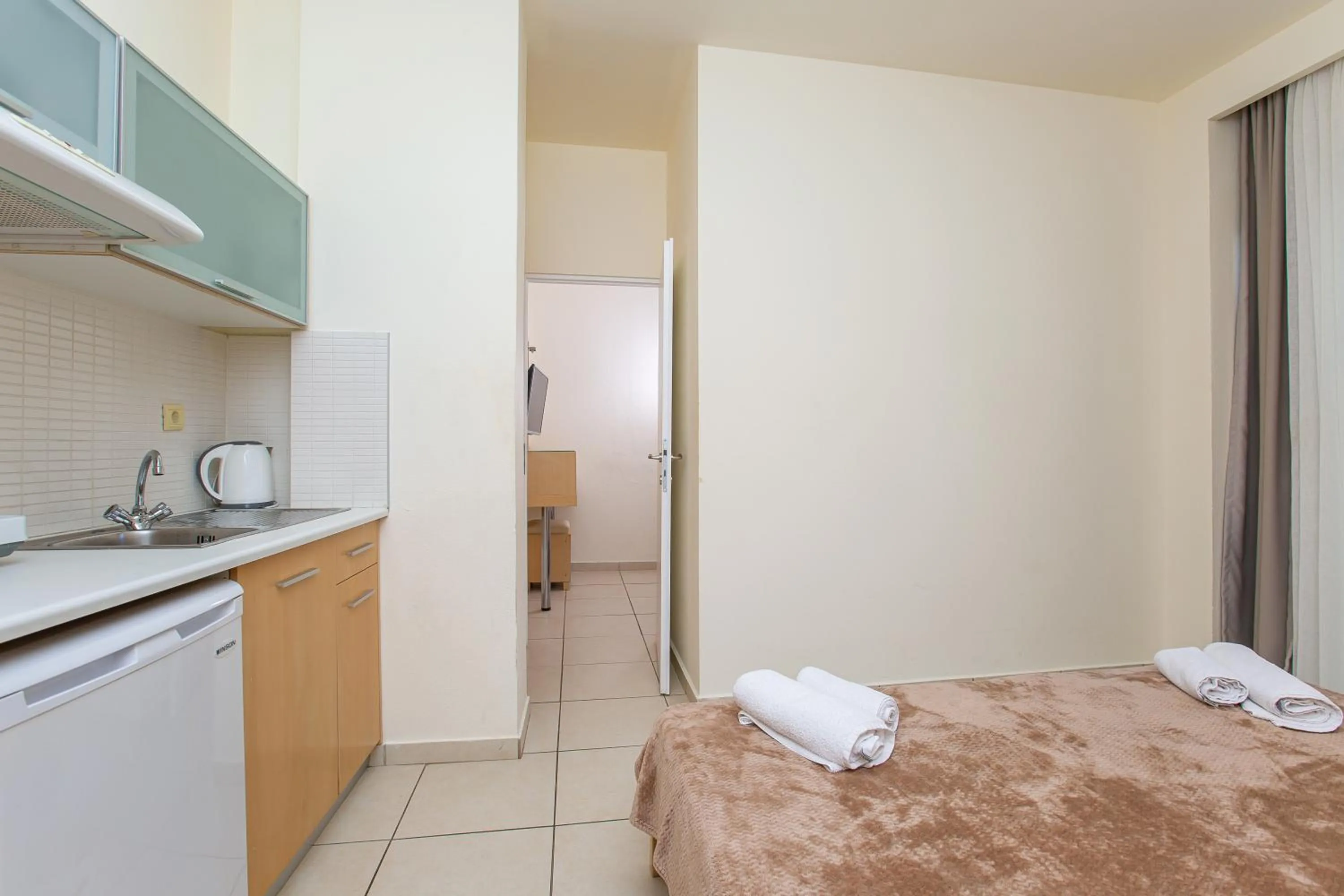 Kitchen or kitchenette, Bed in Hermes Hotel