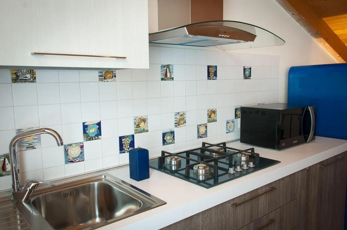 Kitchen or kitchenette in Appartamenti Antico Frantoio Doria