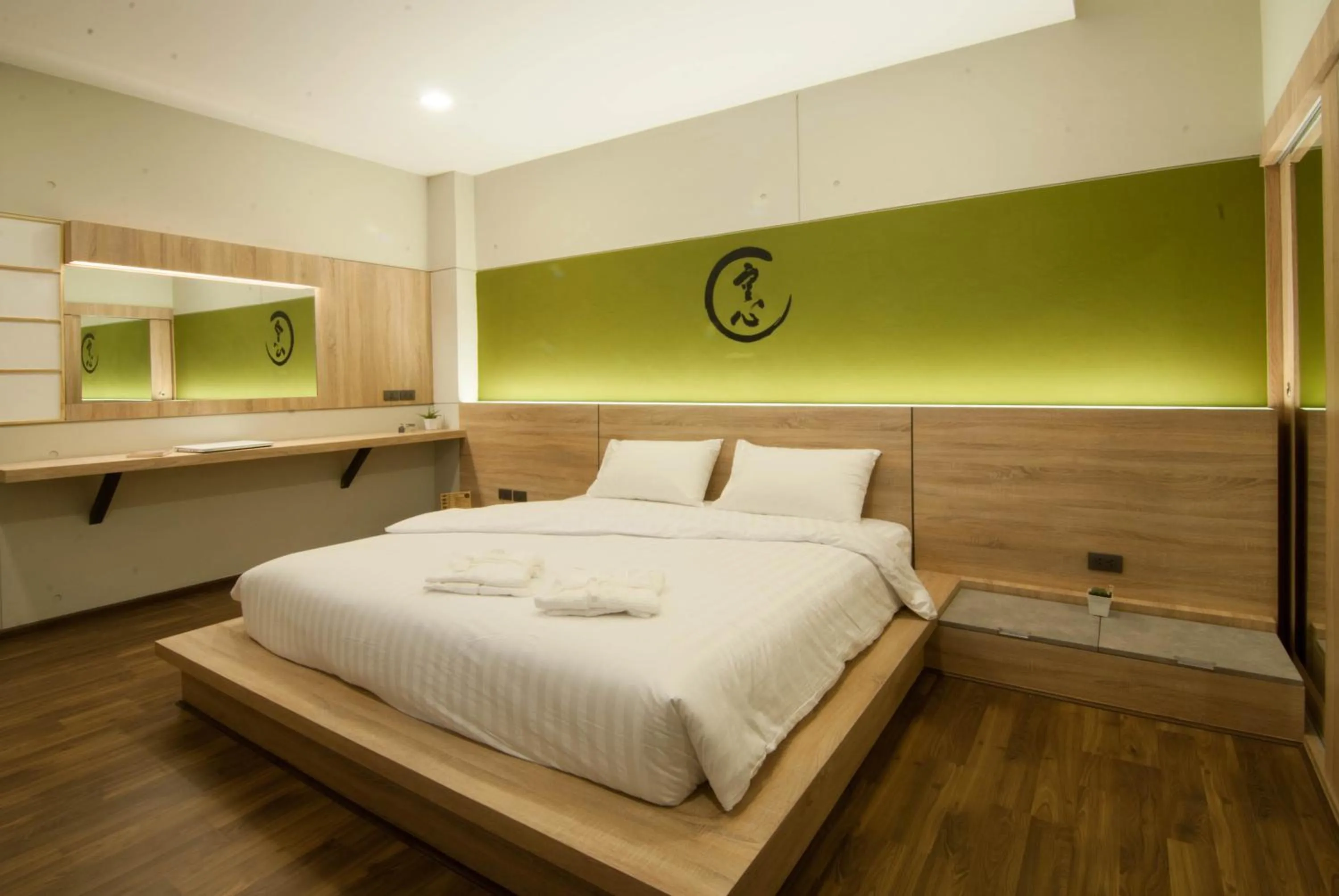 Bed in The Zenith Residence Hotel