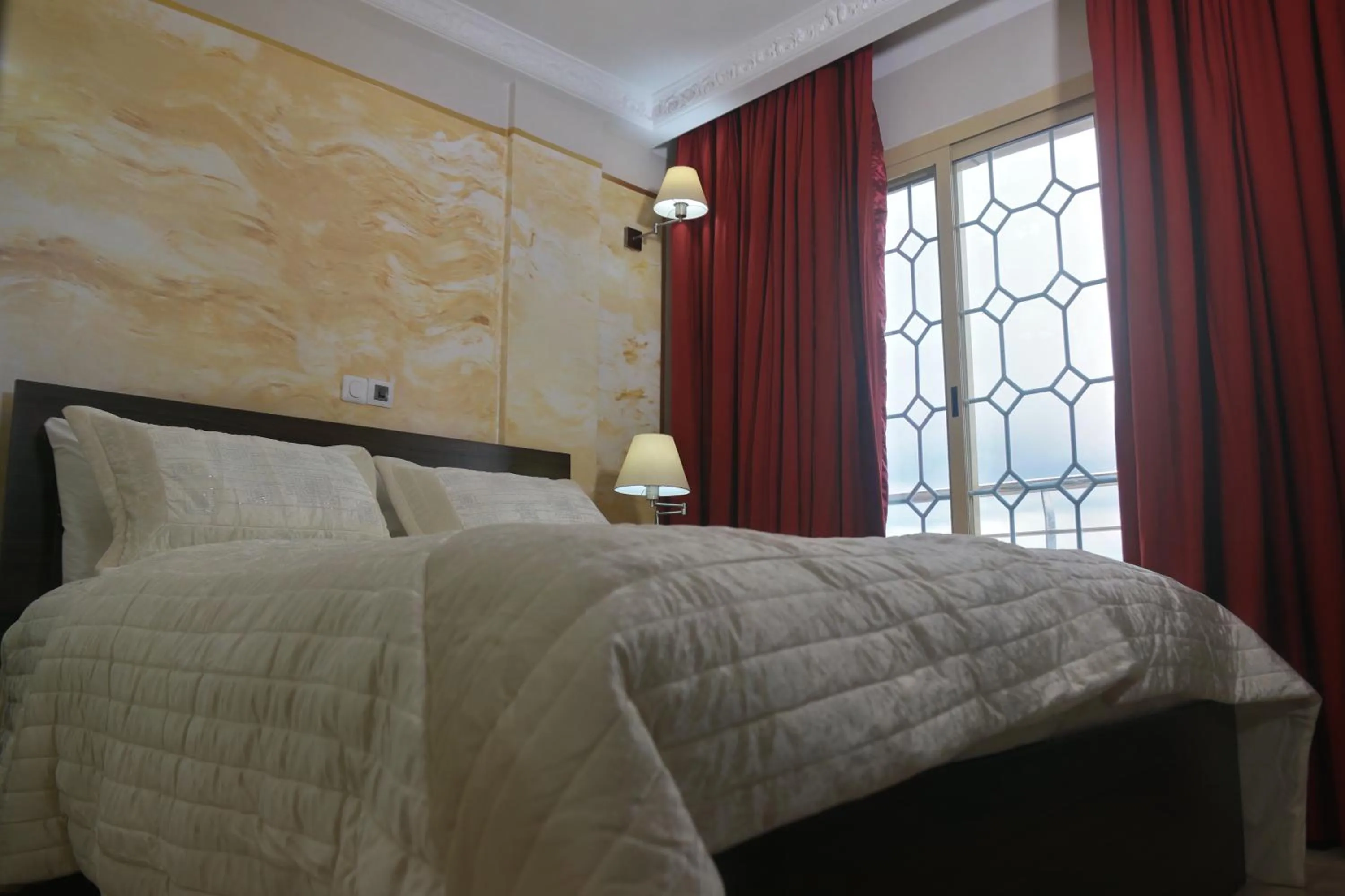 Bed in Noubou International Hotel