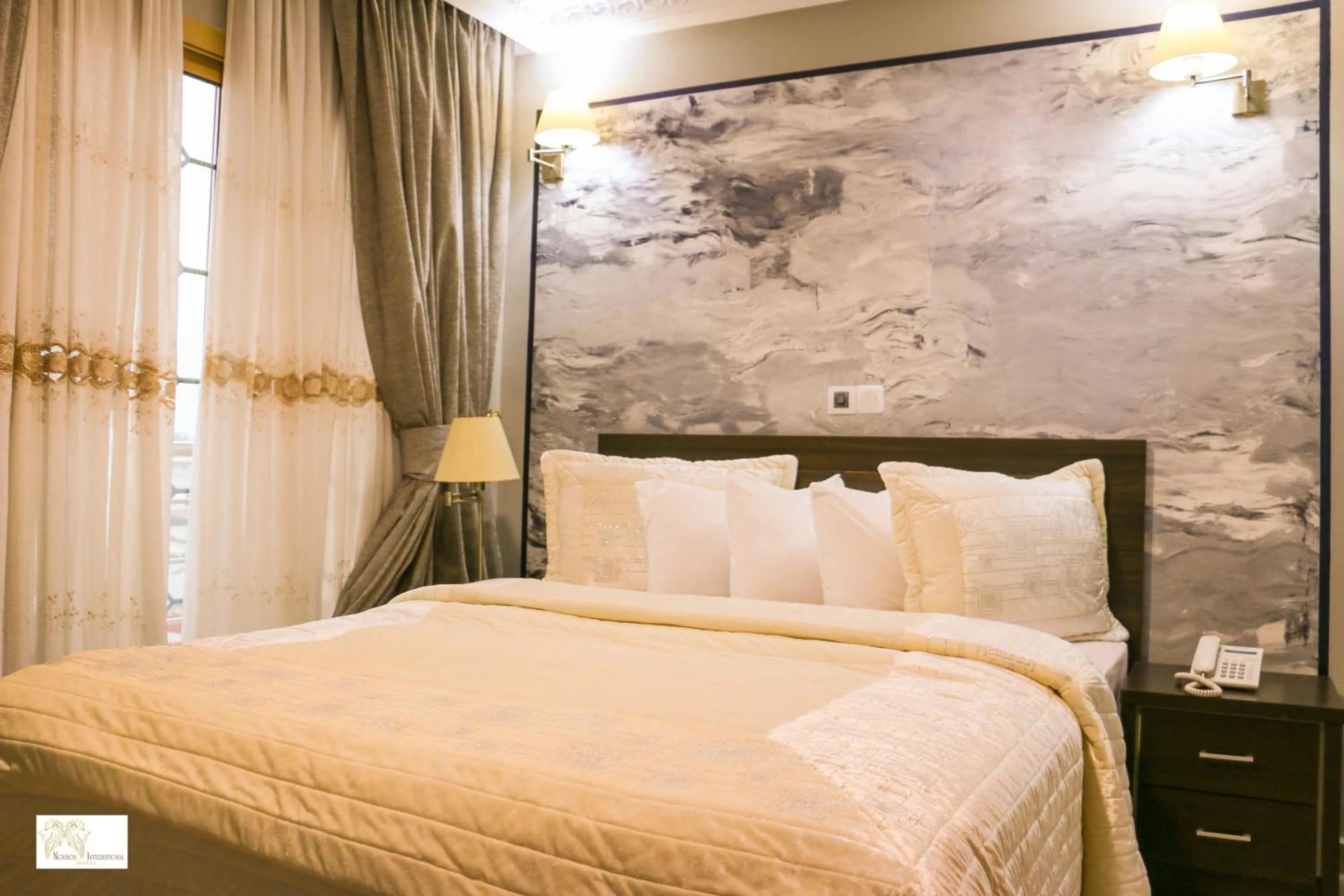 Bed in Noubou International Hotel