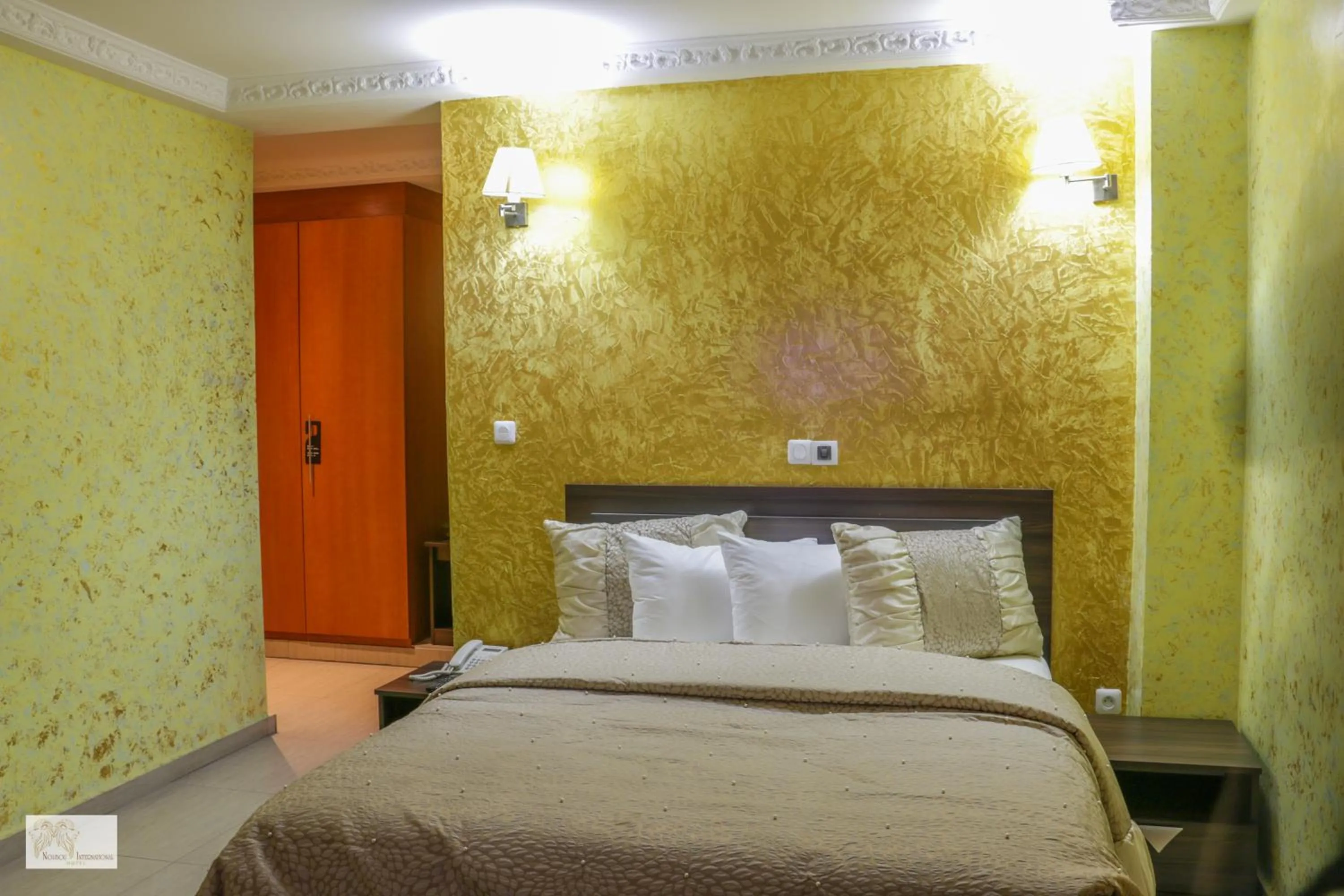 Bedroom in Noubou International Hotel