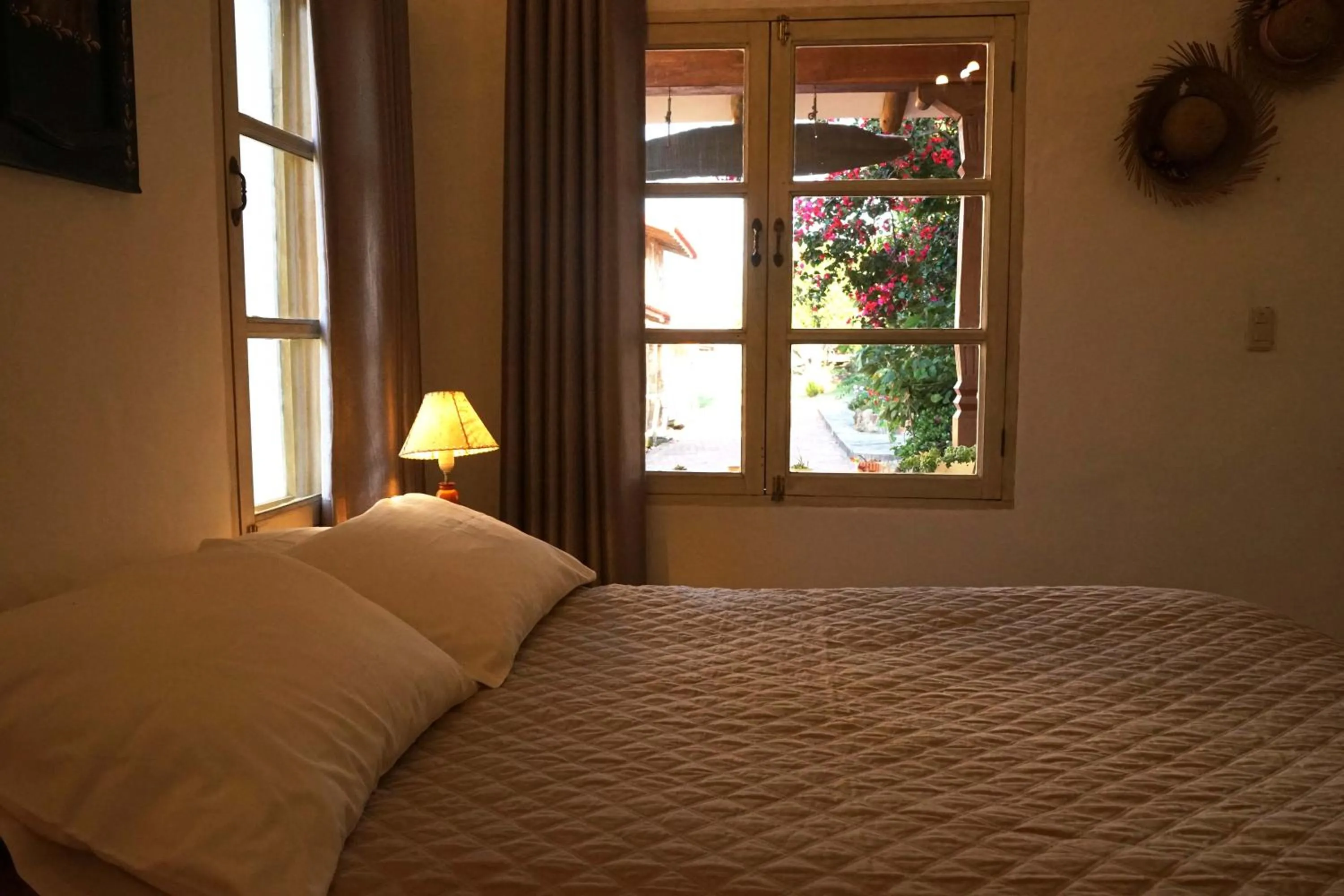 Bed in El Pueblito Hotel Boutique