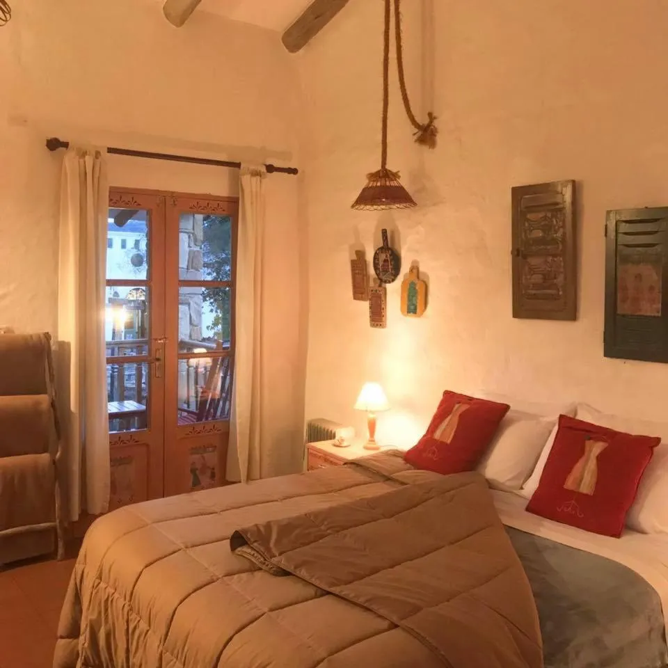 Bed in El Pueblito Hotel Boutique