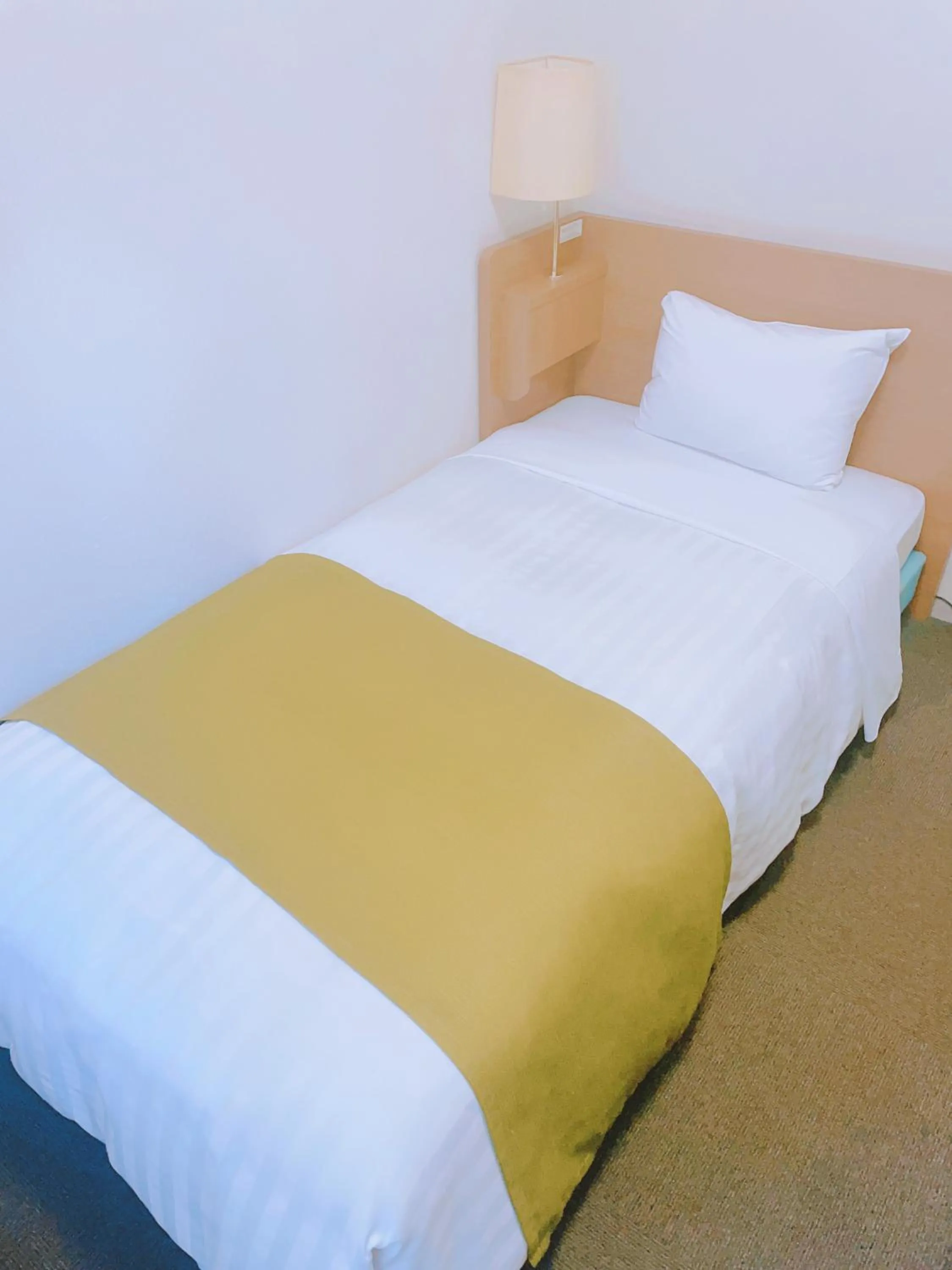 Bed in Fuchu Urban Hotel