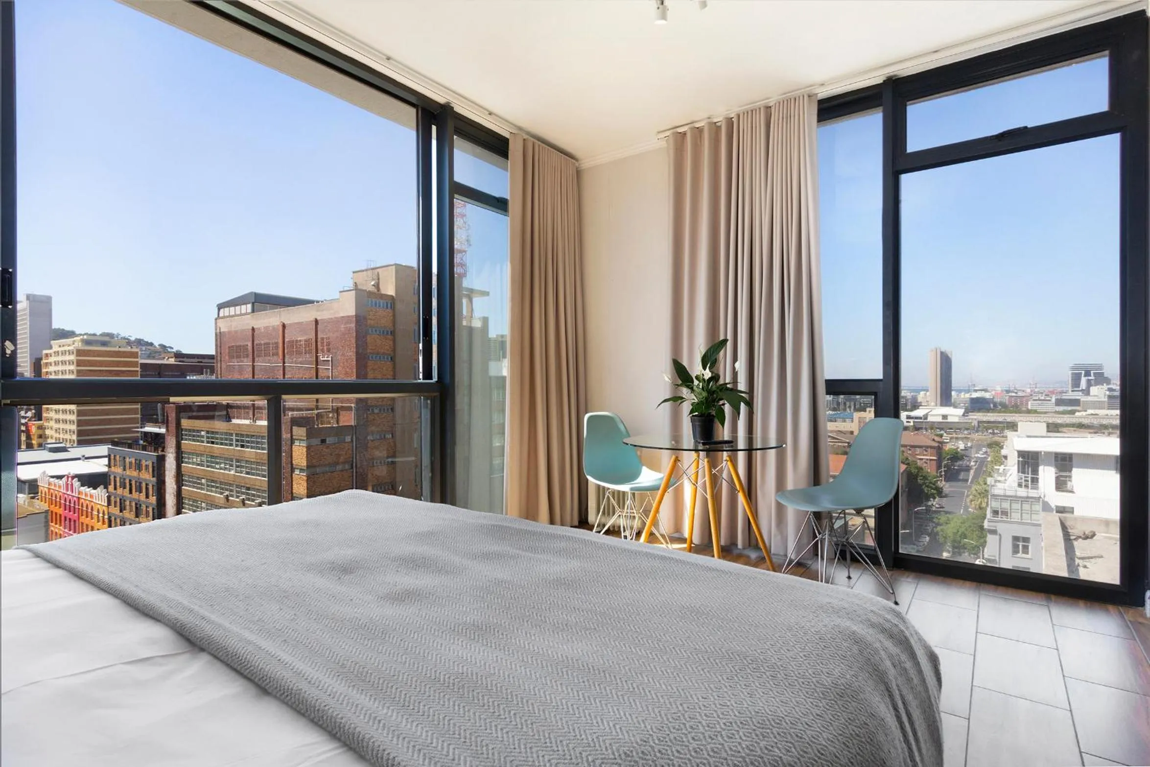 Living room, Bed in Urban Oasis At The Four Seasons