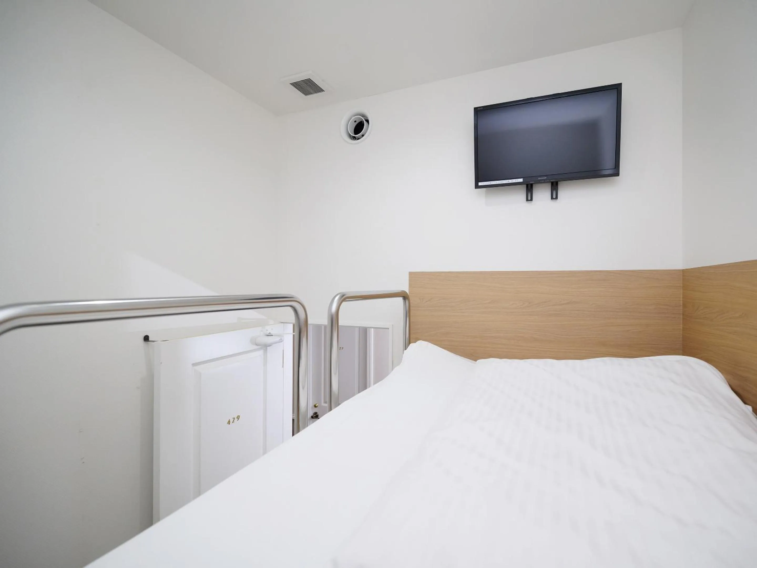 Bed in HOTEL THE CUBE Naha Kokusai Street