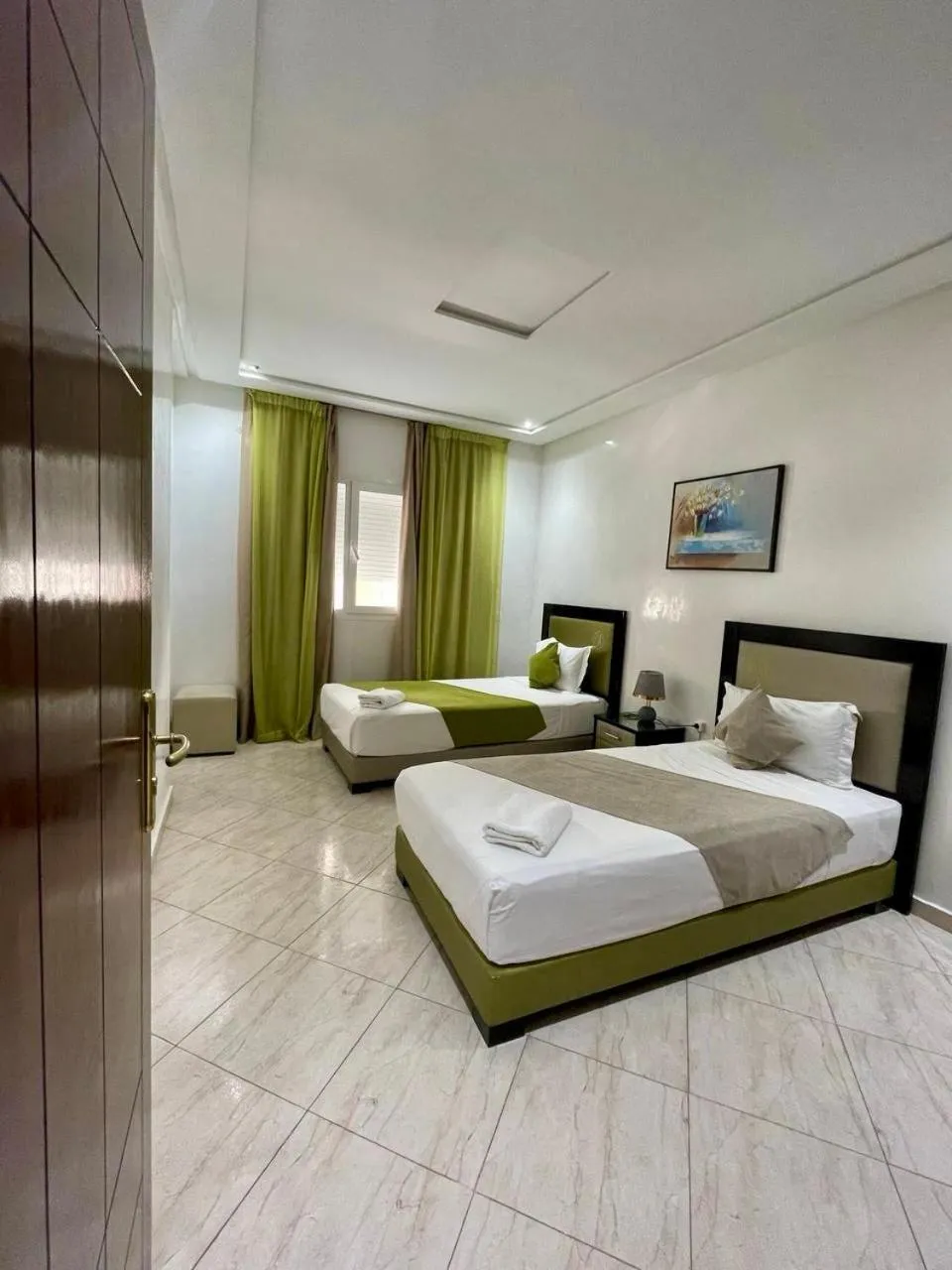 Bed in Appart Hotel Rania