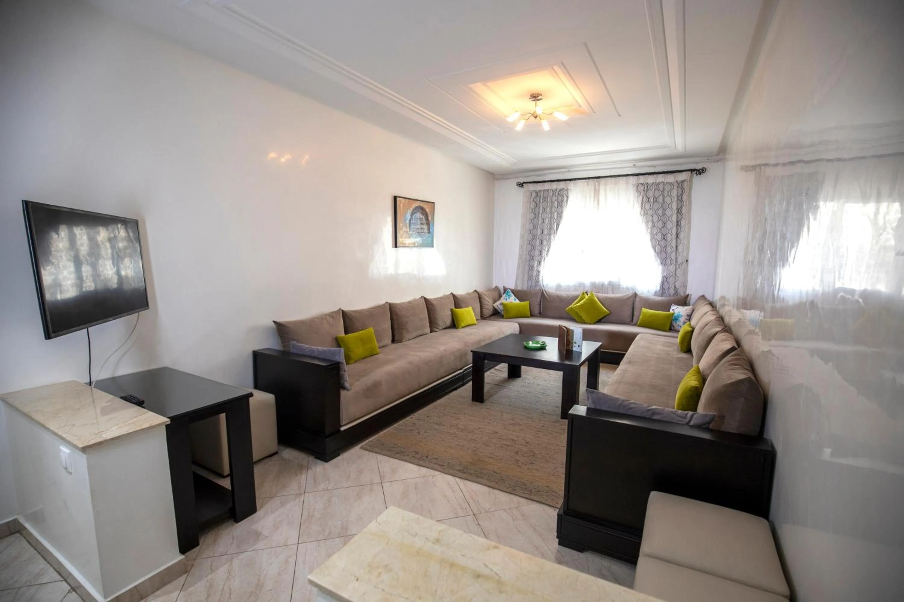 Communal lounge/ TV room in Appart Hotel Rania