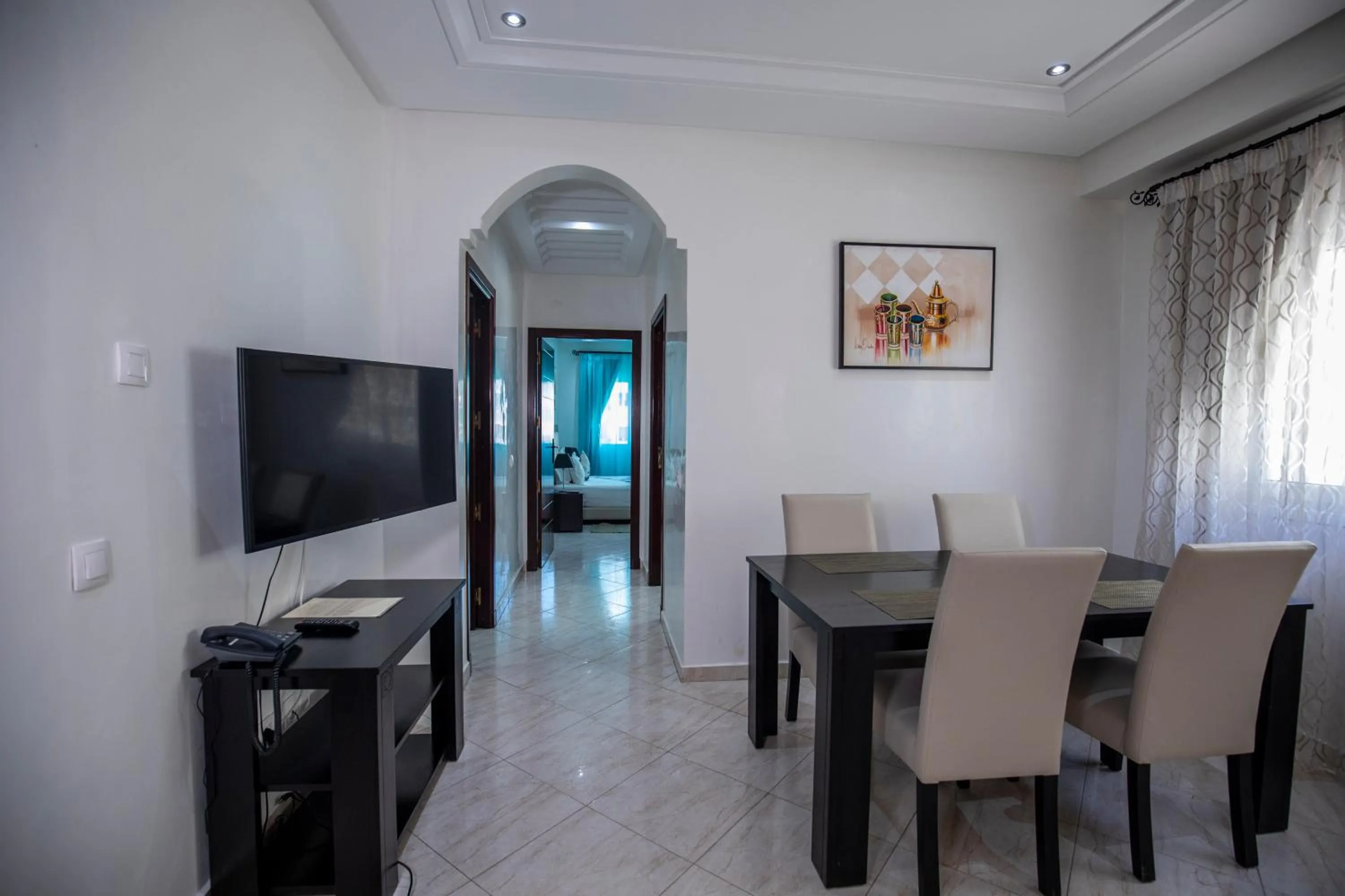 Communal lounge/ TV room in Appart Hotel Rania