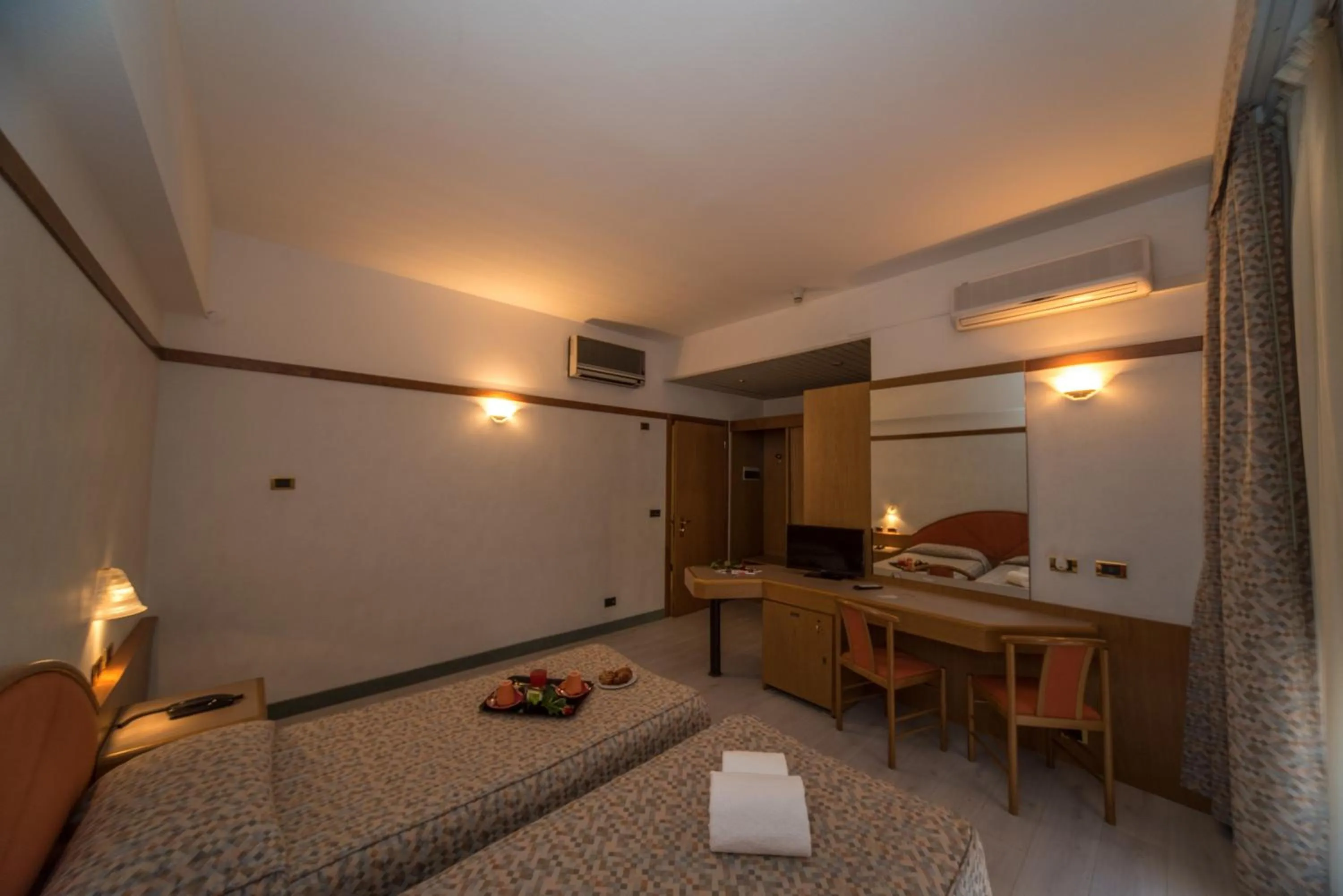 Bedroom in New Petit Hotel