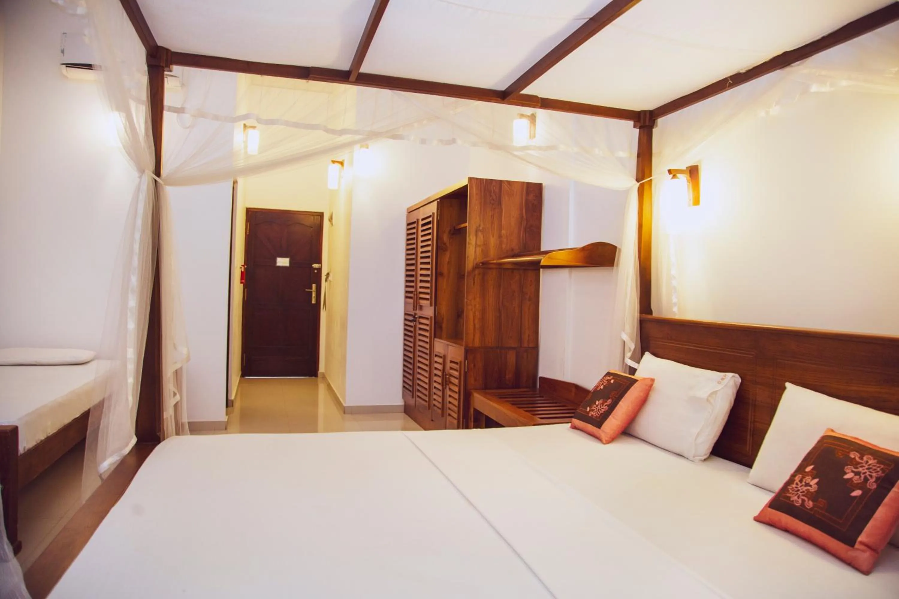 Bed in Prince Beach Hotel Bentota