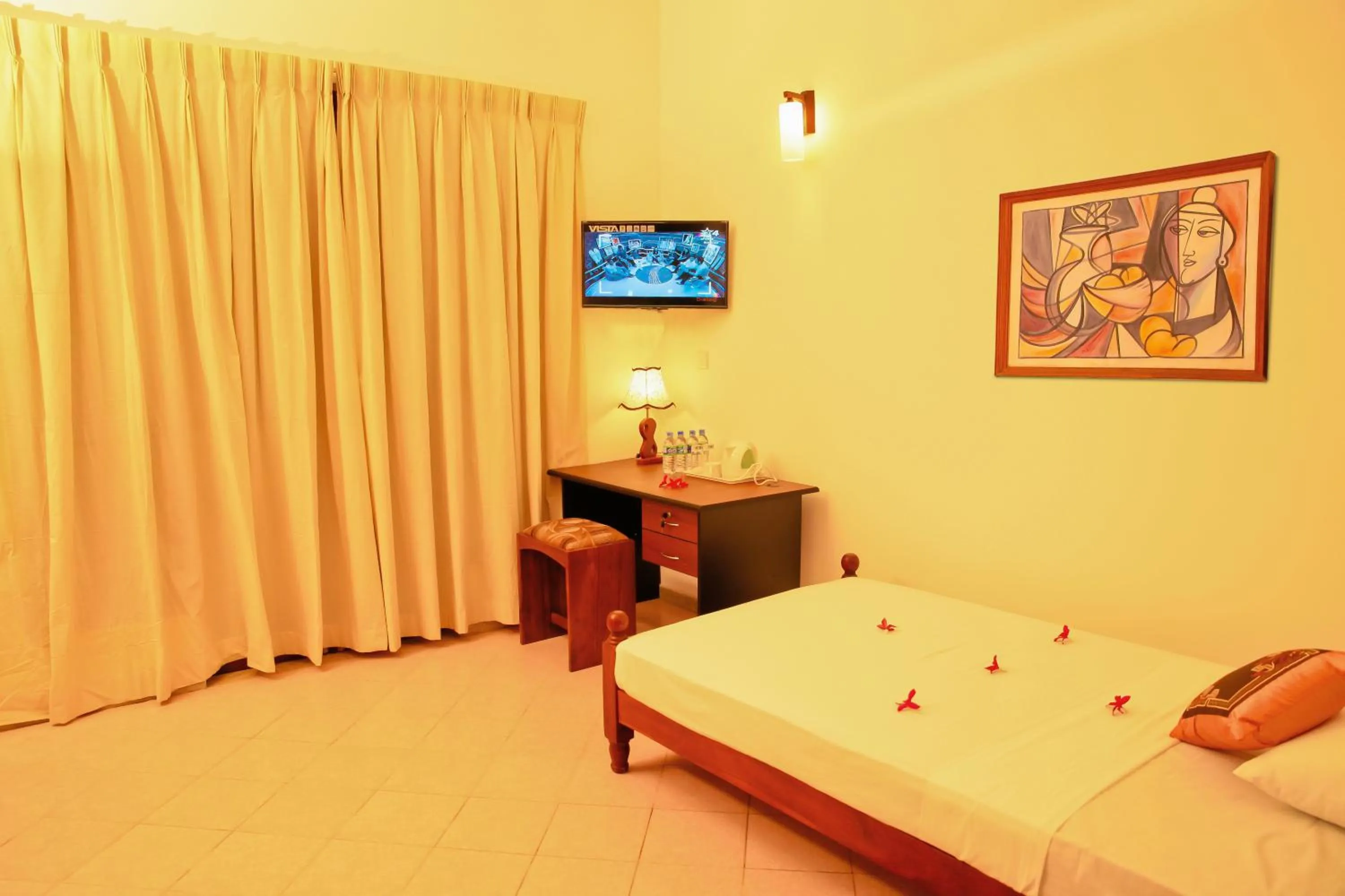 Bed in Prince Beach Hotel Bentota