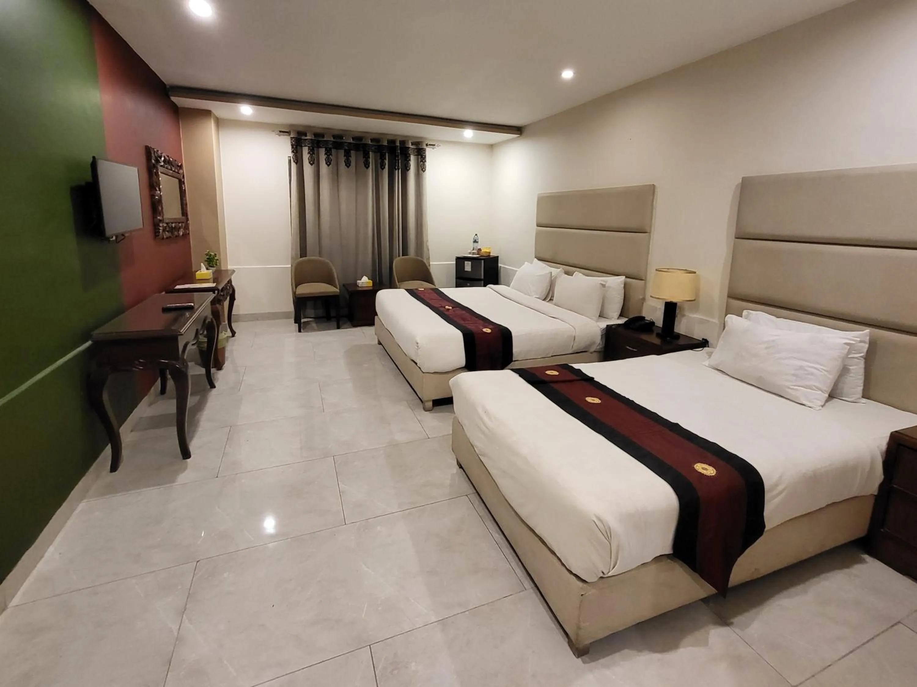 Bed in Grand Millennium Hotel