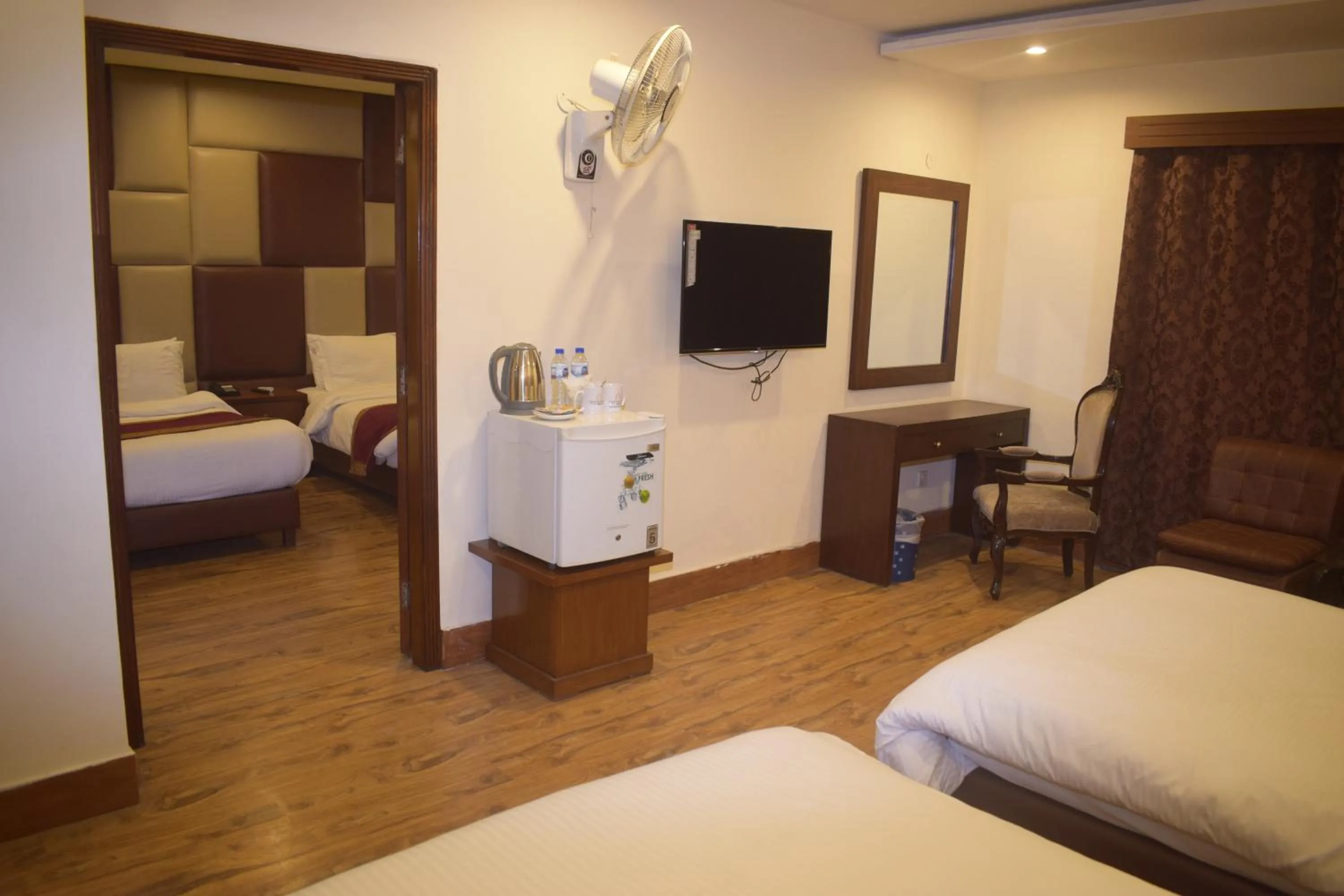 Communal lounge/ TV room in Grand Millennium Hotel