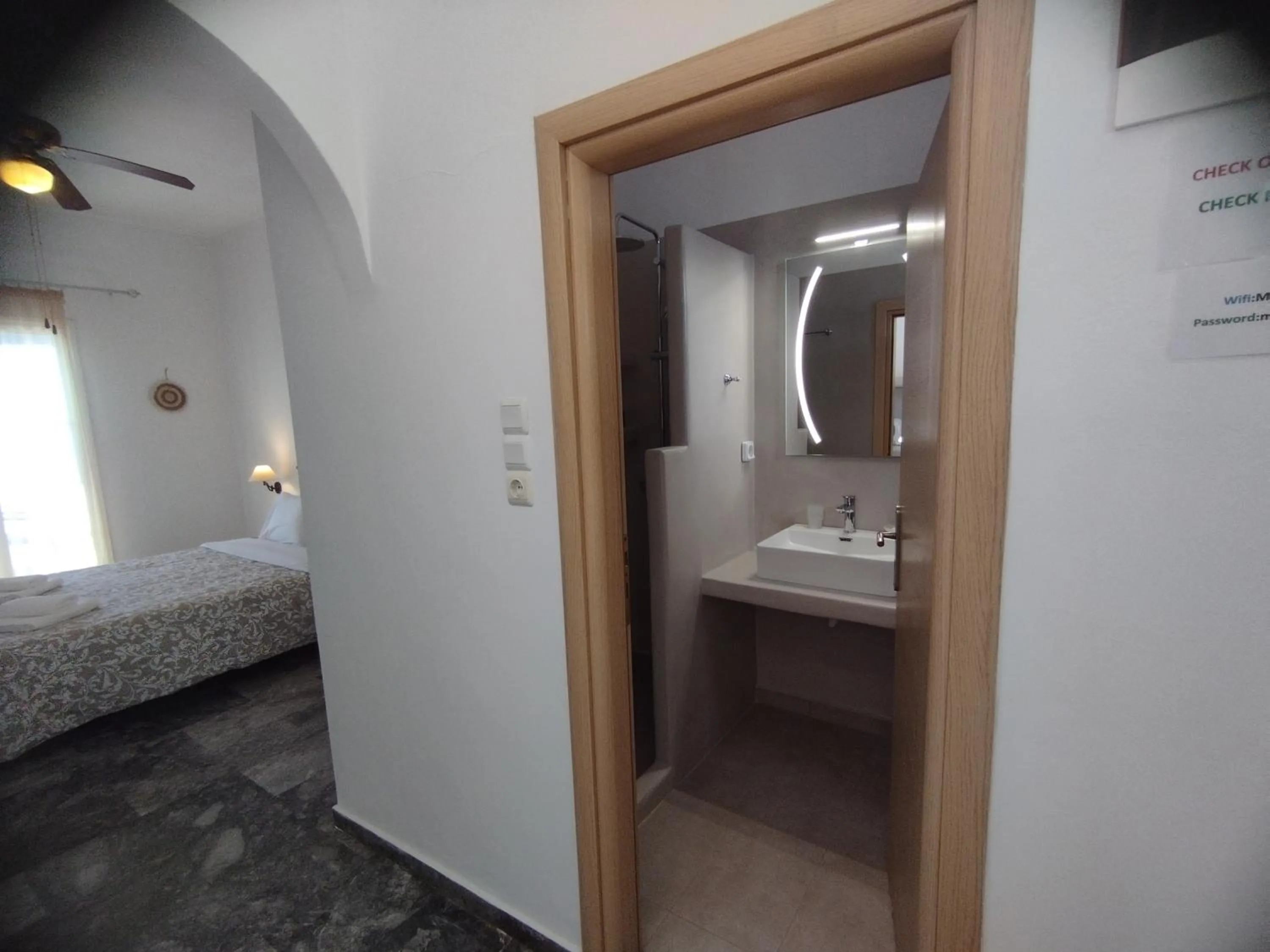 Bathroom, Bed in Marisini Sea View