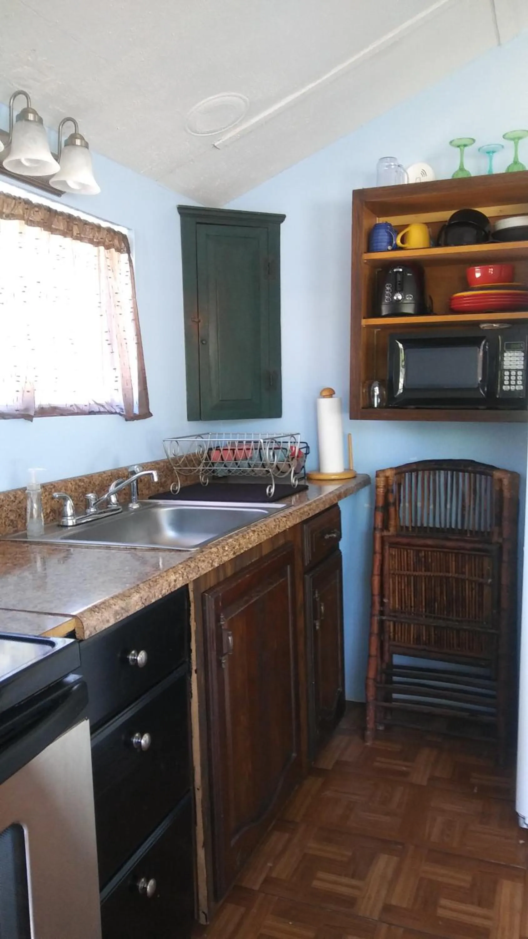 Kitchen or kitchenette in 1 Beige Cozy Bungalow or 1 White Cozy Efficiency Cottage in Titusville