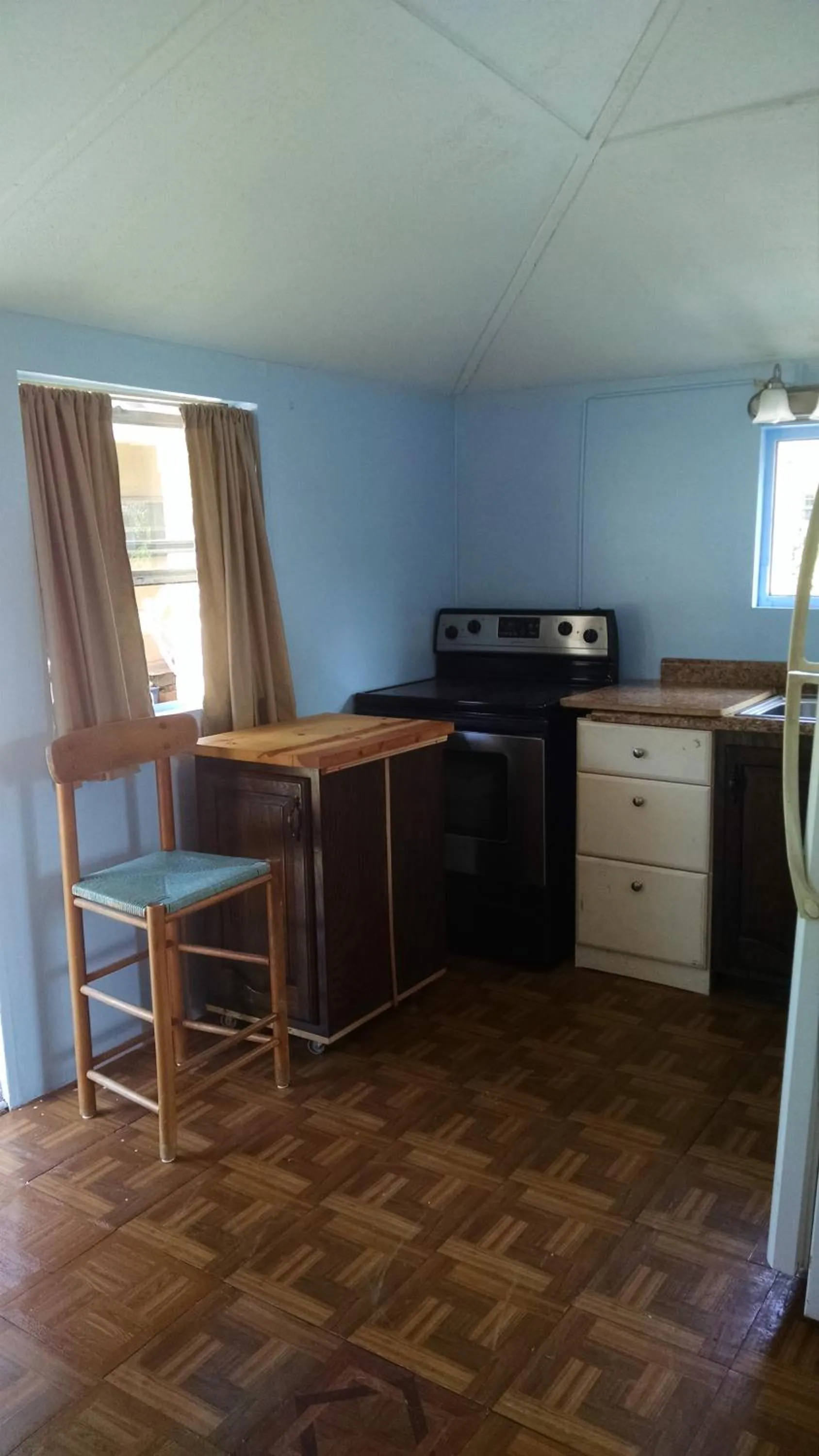 Kitchen or kitchenette in 1 Beige Cozy Bungalow or 1 White Cozy Efficiency Cottage in Titusville